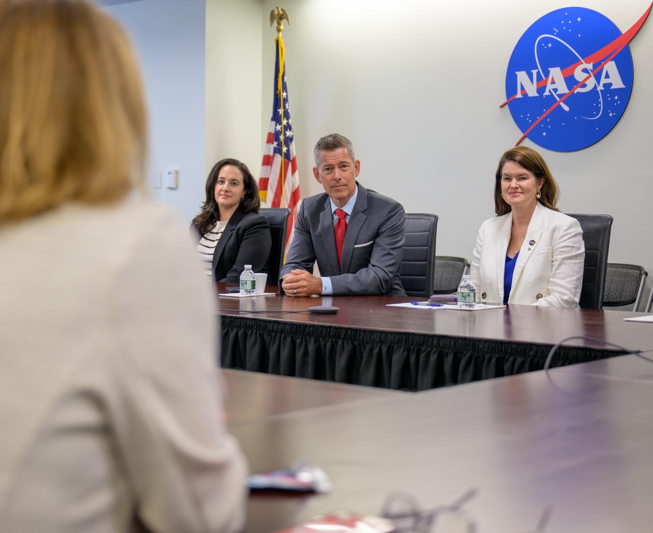 Acting NASA Administrator Sean Duffy, center, along with NASA Deputy Chief of Staff Jacyln Jester, left, and NASA Deputy Associate Administrator Casey Swails, right, speaks with NASA leadership, Friday, July 18, 2025, at the Mary W. Jackson NASA Headquarters Building in Washington. Photo Credit: (NASA/Bill Ingalls)