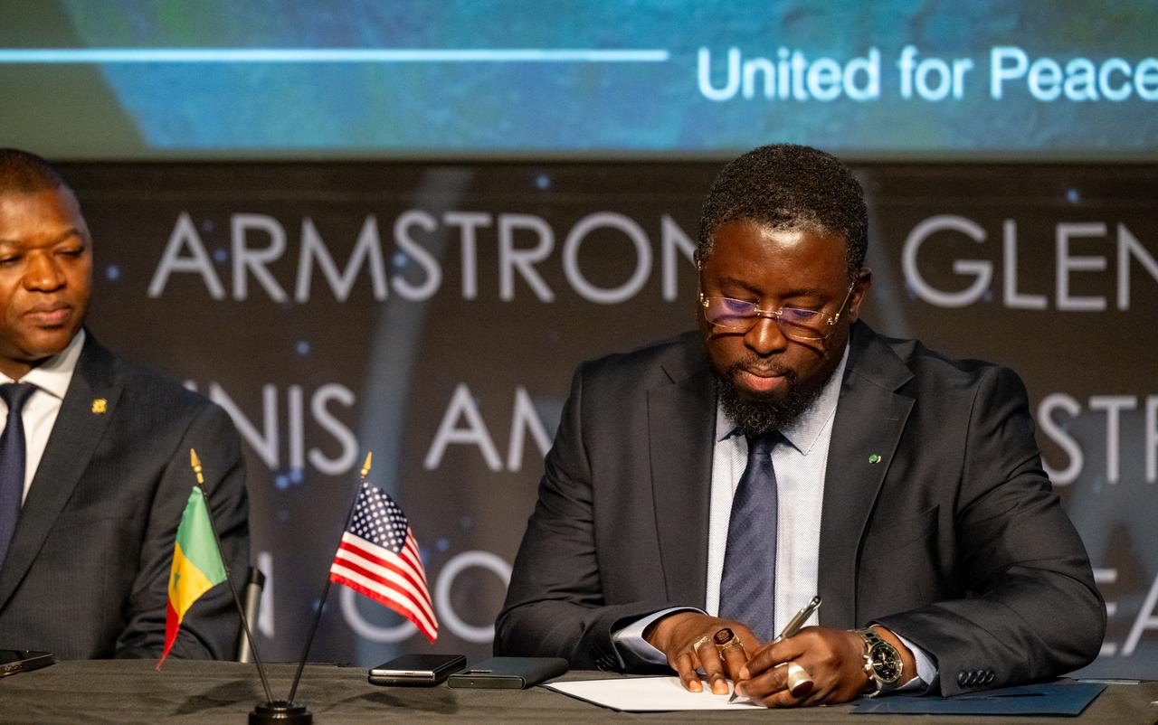 Director General of the Senegalese space agency (ASES) Maram Kairé, right, signs the Artemis Accords Thursday, July 24, 2025, at the Mary W. Jackson NASA Headquarters building in Washington. Senegal is the 56th country to sign the Artemis Accords, which establish a practical set of principles to guide space exploration cooperation among nations participating in NASA’s Artemis program. Photo Credit: (NASA/Keegan Barber)