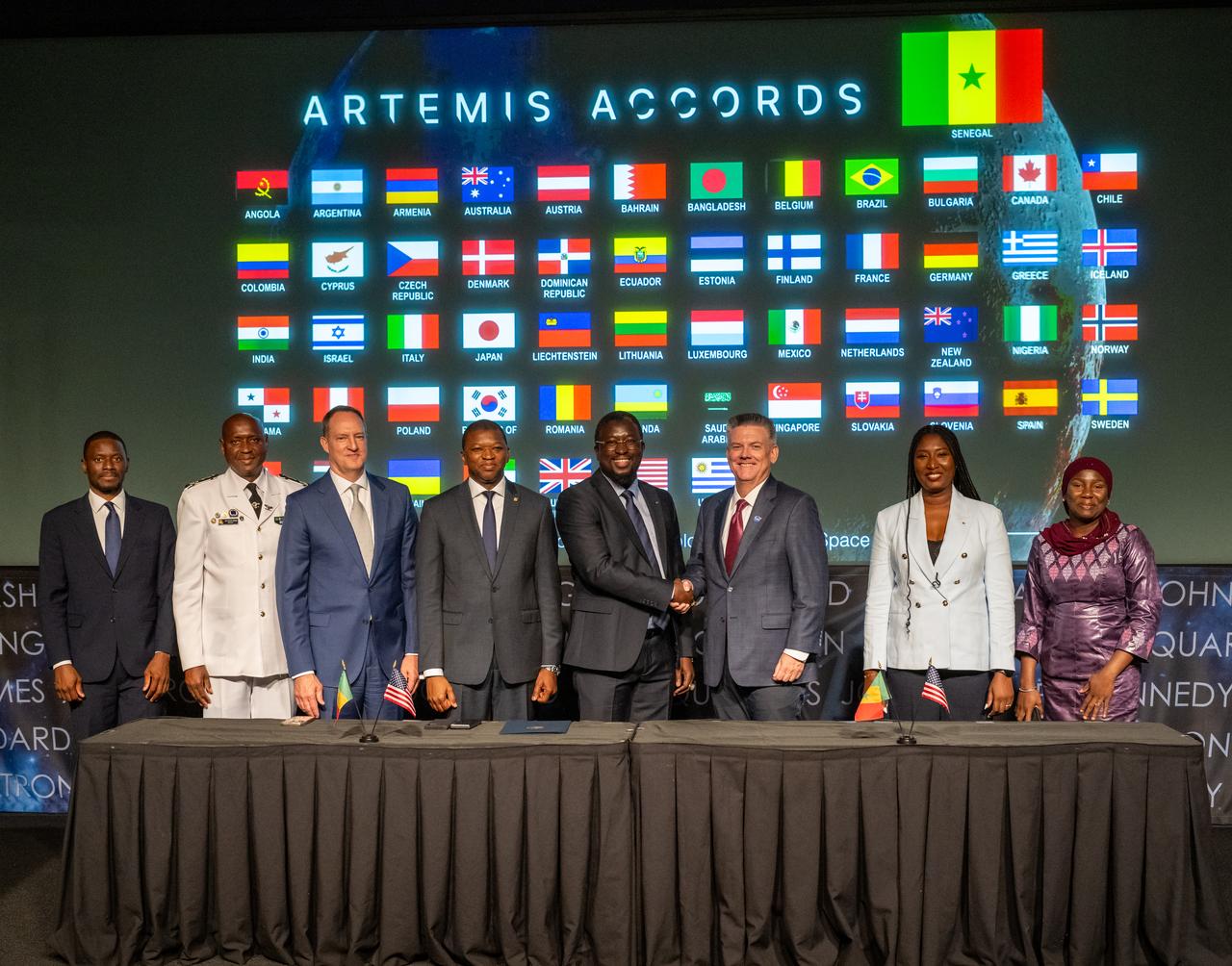 Third from left to right, Department of State Bureau of African Affairs Senior Bureau Official Jonathan Pratt, Ambassador of Senegal to the United States Abdoul Wahab Haidara, Director General of the Senegalese space agency (ASES) Maram Kairé, NASA Chief of Staff Brian Hughes, and members of the Senegalese delegation pose for a photo during an Artemis Accords signing ceremony Thursday, July 24, 2025, at the Mary W. Jackson NASA Headquarters building in Washington. Senegal is the 56th country to sign the Artemis Accords, which establish a practical set of principles to guide space exploration cooperation among nations participating in NASA’s Artemis program. Photo Credit: (NASA/Keegan Barber)