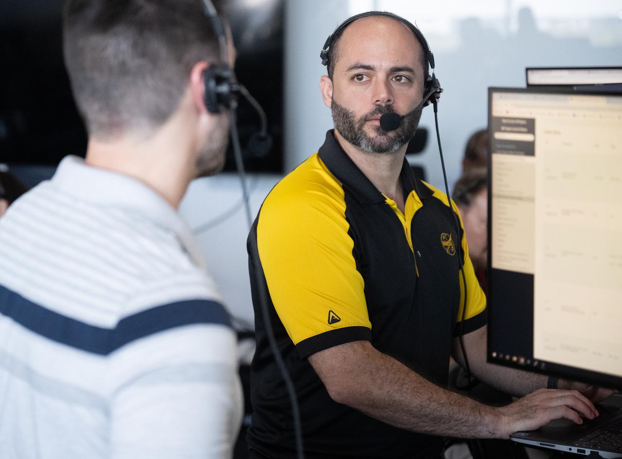 Max Schneiderman, an aerospace flight systems engineer at NASA, talks with John Posey, lead engineer for Dragon in NASA's Commercial Crew Program, as they monitor the countdown during a dress rehearsal in preparation for the launch of a SpaceX Falcon 9 rocket carrying the company's Dragon spacecraft on NASA’s SpaceX Crew-11 mission with NASA astronauts Zena Cardman, Mike Fincke, JAXA (Japan Aerospace Exploration Agency) astronaut Kimiya Yui, and Roscosmos cosmonaut Oleg Platonov onboard, Monday, July 28, 2025, in the control room of SpaceX’s HangerX at NASA’s Kennedy Space Center in Florida. NASA’s SpaceX Crew-11 mission is the eleventh crew rotation mission of the SpaceX Dragon spacecraft and Falcon 9 rocket to the International Space Station as part of the agency’s Commercial Crew Program. Cardman, Fincke, Yui, Platonov are scheduled to launch on 12:09 p.m. EDT on Thursday, July 31, from Launch Complex 39A at the NASA's Kennedy Space Center. Photo Credit: (NASA/Joel Kowsky)