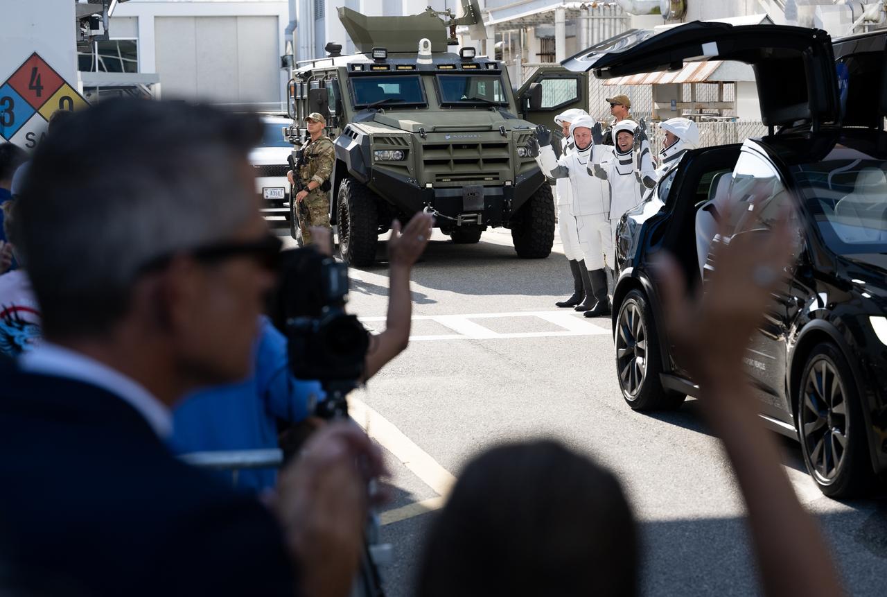 NASA astronauts Zena Cardman, Mike Fincke, JAXA (Japan Aerospace Exploration Agency) astronaut Kimiya Yui, and Roscosmos cosmonaut Oleg Platonov, wearing SpaceX spacesuits, are seen as they prepare to depart the Neil  A. Armstrong Operations and Checkout Building for Launch Complex 39A on NASA's Kennedy Space Center to board the SpaceX Dragon spacecraft for the Crew-11 mission launch, Thursday, July 31, 2025, at NASA’s Kennedy Space Center in Florida. NASA’s SpaceX Crew-11 mission is the eleventh crew rotation mission of the SpaceX Crew Dragon spacecraft and Falcon 9 rocket to the International Space Station as part of the agency’s Commercial Crew Program. Cardman, Fincke, Yui, Platonov are scheduled to launch at 12:09 p.m. EDT, from Launch Complex 39A at the NASA's Kennedy Space Center.  Photo Credit: (NASA/Joel Kowsky)