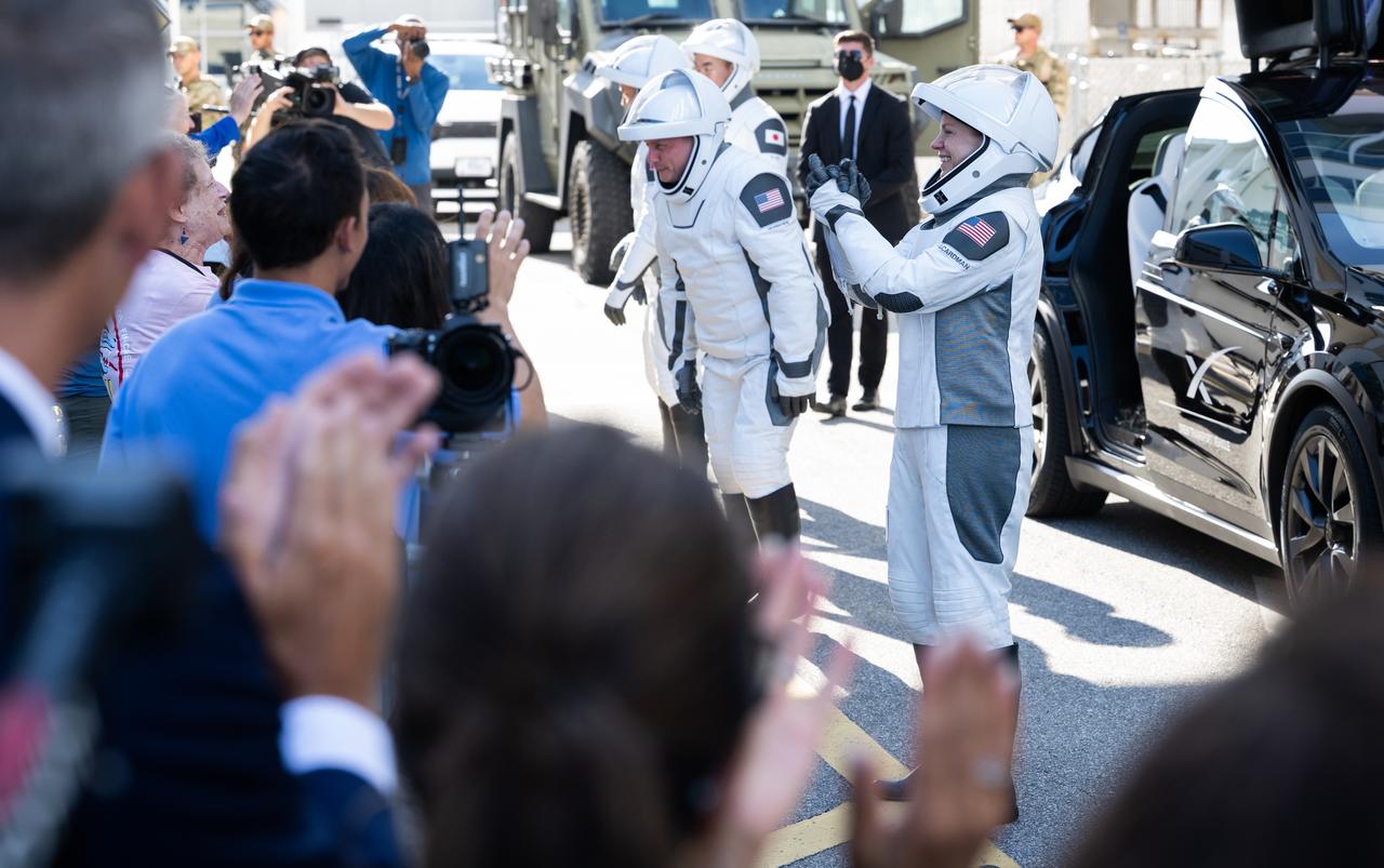 NASA astronauts Zena Cardman, right, Mike Fincke, JAXA (Japan Aerospace Exploration Agency) astronaut Kimiya Yui, and Roscosmos cosmonaut Oleg Platonov, wearing SpaceX spacesuits, talk to family and friends as they prepare to depart the Neil  A. Armstrong Operations and Checkout Building for Launch Complex 39A on NASA's Kennedy Space Center to board the SpaceX Dragon spacecraft for the Crew-11 mission launch, Thursday, July 31, 2025, at NASA’s Kennedy Space Center in Florida. NASA’s SpaceX Crew-11 mission is the eleventh crew rotation mission of the SpaceX Crew Dragon spacecraft and Falcon 9 rocket to the International Space Station as part of the agency’s Commercial Crew Program. Cardman, Fincke, Yui, Platonov are scheduled to launch at 12:09 p.m. EDT, from Launch Complex 39A at the NASA's Kennedy Space Center.  Photo Credit: (NASA/Joel Kowsky)