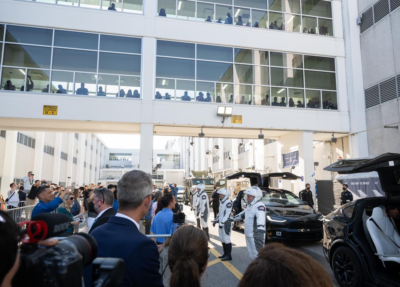 NASA astronauts Mike Fincke, Zena Cardman, JAXA (Japan Aerospace Exploration Agency) astronaut Kimiya Yui, and Roscosmos cosmonaut Oleg Platonov, wearing SpaceX spacesuits, talk to family and friends as they prepare to depart the Neil  A. Armstrong Operations and Checkout Building for Launch Complex 39A on NASA's Kennedy Space Center to board the SpaceX Dragon spacecraft for the Crew-11 mission launch, Thursday, July 31, 2025, at NASA’s Kennedy Space Center in Florida. NASA’s SpaceX Crew-11 mission is the eleventh crew rotation mission of the SpaceX Crew Dragon spacecraft and Falcon 9 rocket to the International Space Station as part of the agency’s Commercial Crew Program. Cardman, Fincke, Yui, Platonov are scheduled to launch at 12:09 p.m. EDT, from Launch Complex 39A at the NASA's Kennedy Space Center.  Photo Credit: (NASA/Joel Kowsky)