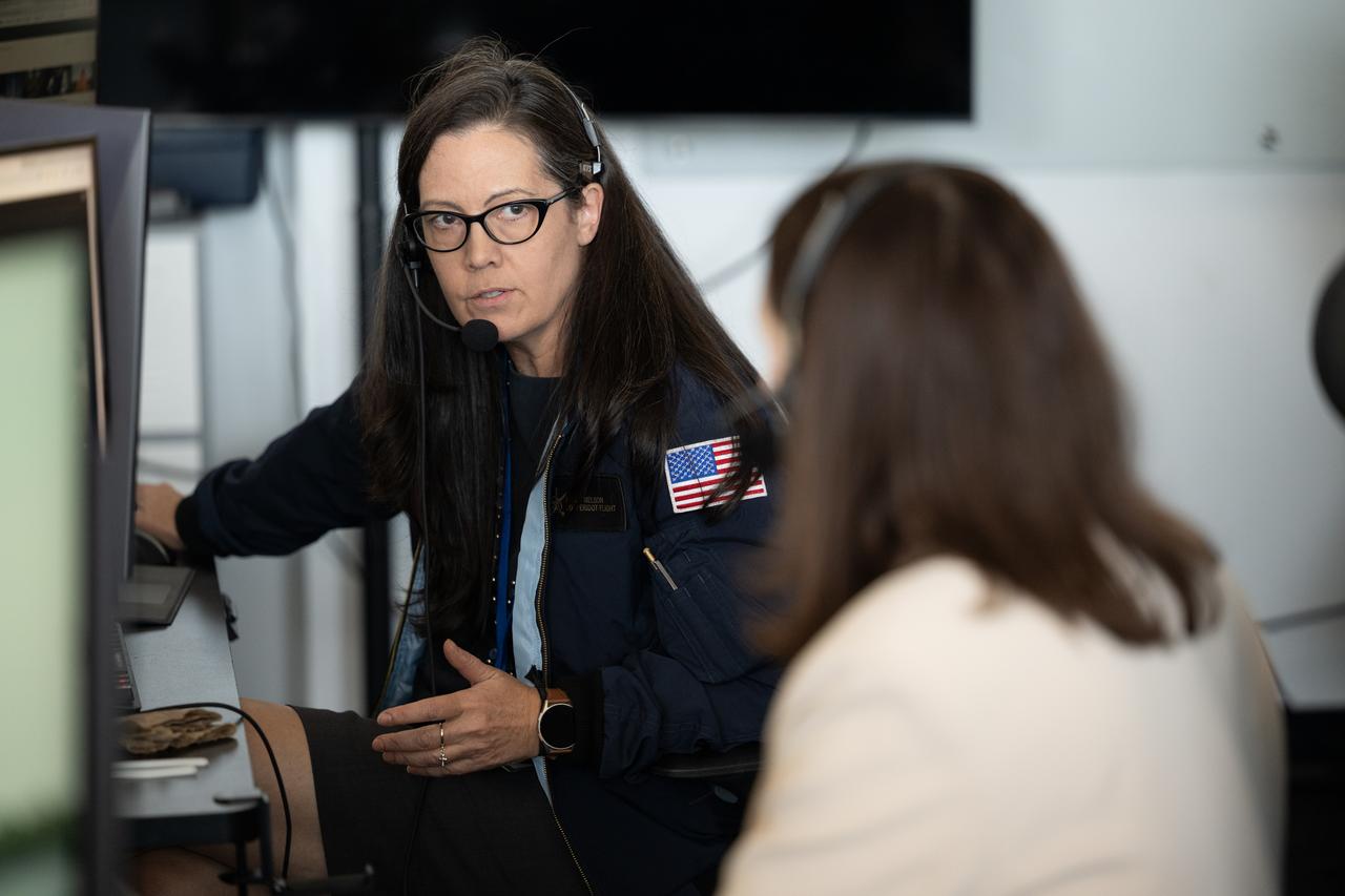 Emily Nelson, NASA's chief flight director, left, speaks with Nicole Jordan, NASA operations manager for the Commercial Crew Program, as they monitor the countdown of a launch attempt of a SpaceX Falcon 9 rocket carrying the company's Dragon spacecraft on NASA’s SpaceX Crew-11 mission with NASA astronauts Zena Cardman, Mike Fincke, JAXA (Japan Aerospace Exploration Agency) astronaut Kimiya Yui, and Roscosmos cosmonaut Oleg Platonov onboard, Thursday, July 31, 2025, in the control center of SpaceX’s HangarX at NASA’s Kennedy Space Center in Florida. NASA’s SpaceX Crew-11 mission is the eleventh crew rotation mission of the SpaceX Dragon spacecraft and Falcon 9 rocket to the International Space Station as part of the agency’s Commercial Crew Program. Today’s launch of Cardman, Fincke, Yui, Platonov was scrubbed due to weather and is now scheduled for 11:43 a.m. EDT on Friday, August 1, from Launch Complex 39A at the NASA's Kennedy Space Center. Photo Credit: (NASA/Joel Kowsky)