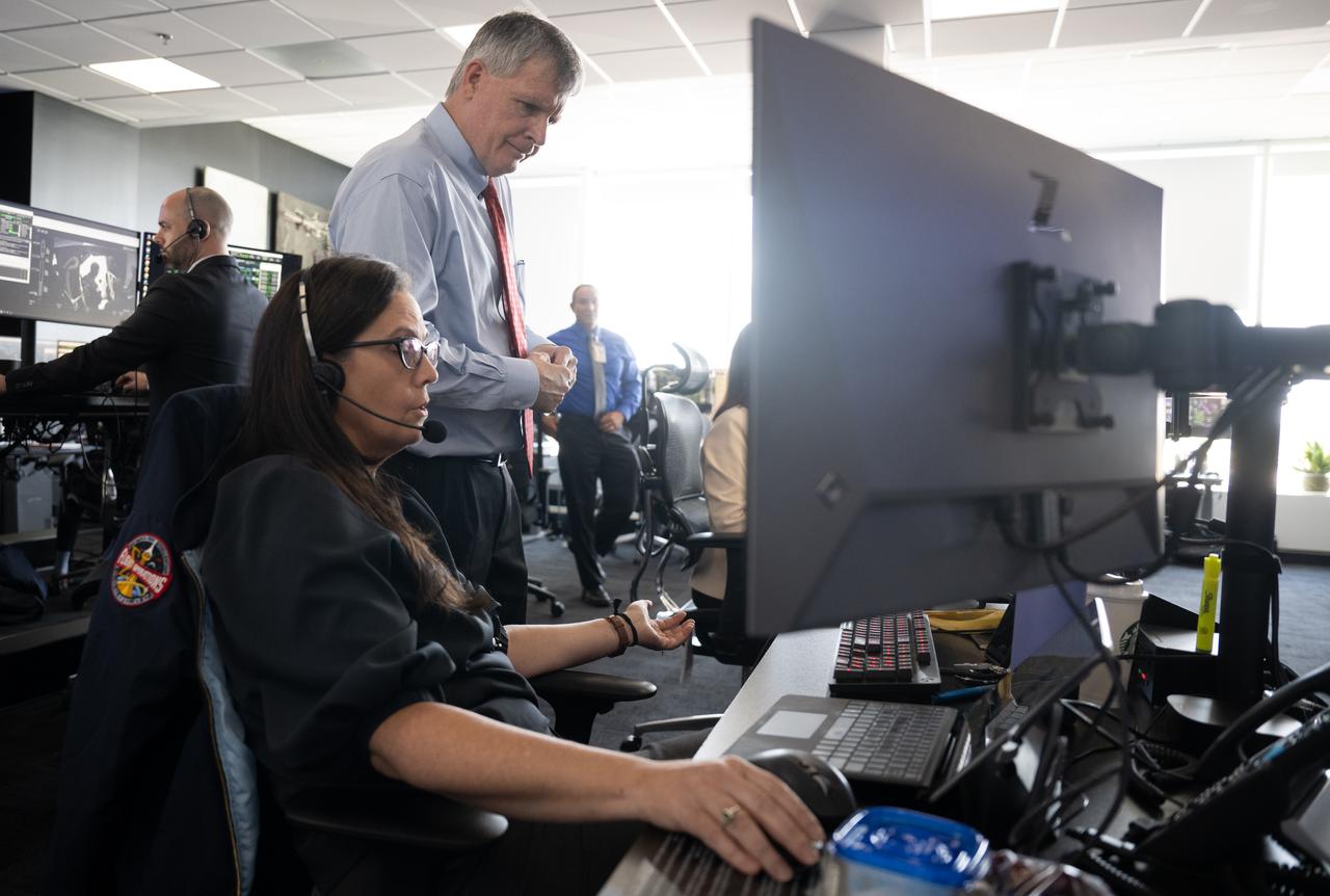 Steve Stich, manager of NASA’s Commercial Crew Program, right, speaks with Emily Nelson, NASA's chief flight director, as teams monitor the countdown of a launch attempt of a SpaceX Falcon 9 rocket carrying the company's Dragon spacecraft on NASA’s SpaceX Crew-11 mission with NASA astronauts Zena Cardman, Mike Fincke, JAXA (Japan Aerospace Exploration Agency) astronaut Kimiya Yui, and Roscosmos cosmonaut Oleg Platonov onboard, Thursday, July 31, 2025, in the control center of SpaceX’s HangarX at NASA’s Kennedy Space Center in Florida. NASA’s SpaceX Crew-11 mission is the eleventh crew rotation mission of the SpaceX Dragon spacecraft and Falcon 9 rocket to the International Space Station as part of the agency’s Commercial Crew Program. Today’s launch of Cardman, Fincke, Yui, Platonov was scrubbed due to weather and is now scheduled for 11:43 a.m. EDT on Friday, August 1, from Launch Complex 39A at the NASA's Kennedy Space Center. Photo Credit: (NASA/Joel Kowsky)