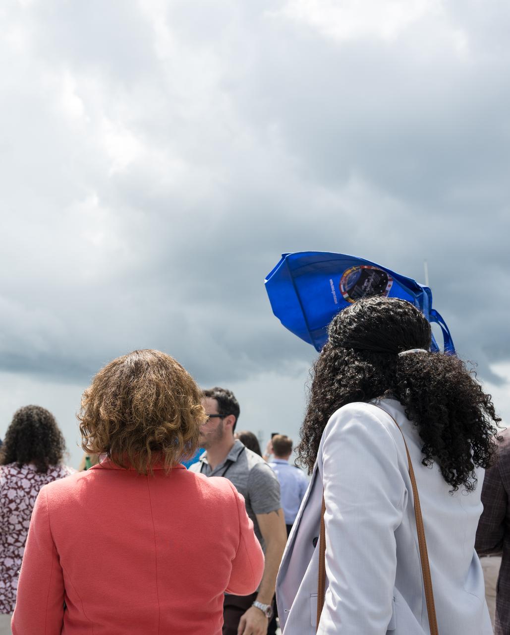 Acting NASA Associate Administrator, Vanessa Wyche, left, and NASA Director of Public Engagement, Aya Collins Williams, watch the first stage of a SpaceX Falcon 9 land at Landing Zone 1 after launching the company’s Dragon spacecraft on NASA’s SpaceX Crew-11 mission to the International Space Station with NASA astronauts Zena Cardman, Mike Fincke, JAXA (Japan Aerospace Exploration Agency) astronaut Kimiya Yui, and Roscosmos cosmonaut Oleg Platonov onboard, Friday, Aug. 1, 2025, from NASA's Kennedy Space Center in Florida. NASA’s SpaceX Crew-11 mission is the eleventh crew rotation mission of the SpaceX Dragon spacecraft and Falcon 9 rocket to the International Space Station as part of the agency’s Commercial Crew Program. Cardman, Fincke, Yui, Platonov launched at 11:43 a.m. EDT from Launch Complex 39A at the NASA's Kennedy Space Center to begin a six month mission aboard the orbital outpost. Photo Credit: (NASA/Aubrey Gemignani)