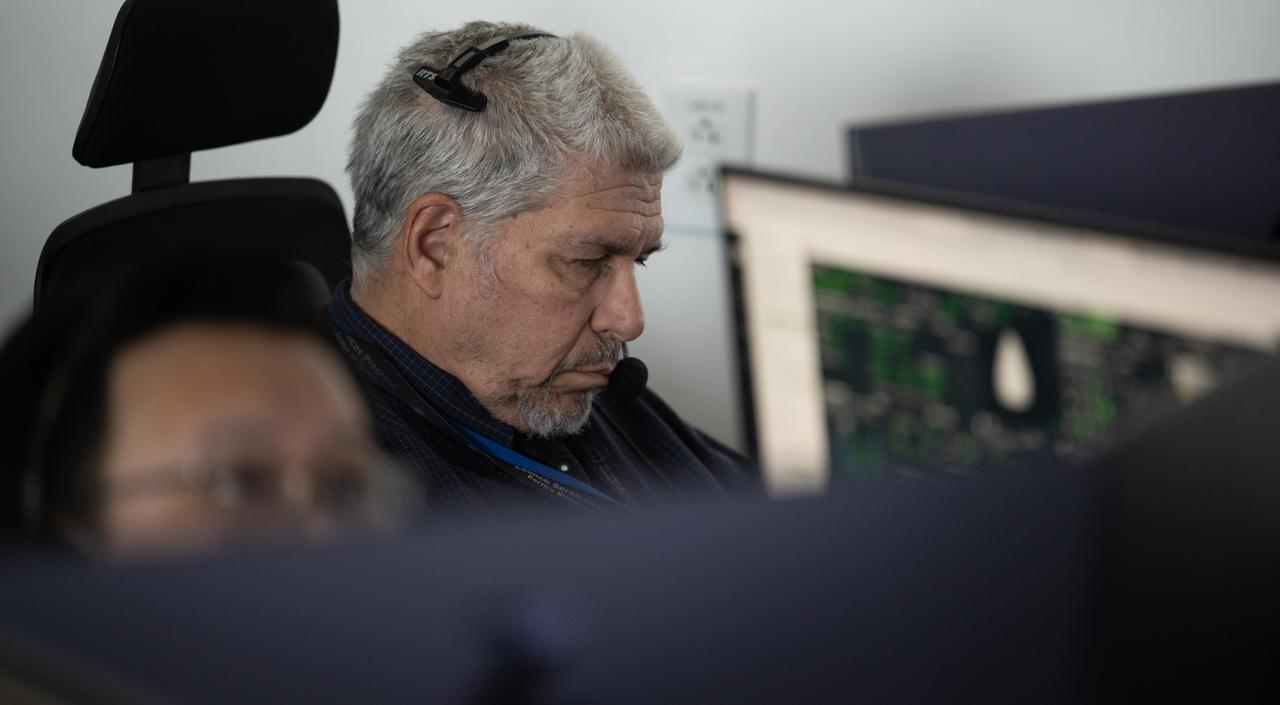 Al Menendez, a spacecraft GNC engineer at NASA, monitor the countdown of the launch of a SpaceX Falcon 9 rocket carrying the company's Dragon spacecraft on NASA’s SpaceX Crew-11 mission with NASA astronauts Zena Cardman, Mike Fincke, JAXA (Japan Aerospace Exploration Agency) astronaut Kimiya Yui, and Roscosmos cosmonaut Oleg Platonov onboard, Friday, Aug. 1, 2025, in the control center of SpaceX’s HangarX at NASA’s Kennedy Space Center in Florida. NASA’s SpaceX Crew-11 mission is the eleventh crew rotation mission of the SpaceX Dragon spacecraft and Falcon 9 rocket to the International Space Station as part of the agency’s Commercial Crew Program. Cardman, Fincke, Yui, Platonov launched at 11:43 a.m. EDT, from Launch Complex 39A at the NASA's Kennedy Space Center. Photo Credit: (NASA/Joel Kowsky)