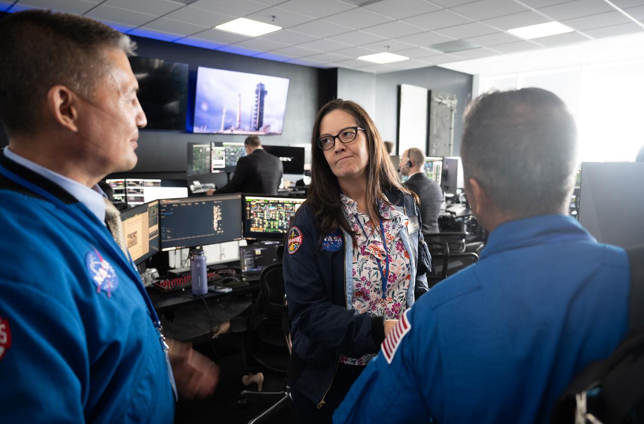 Emily Nelson, NASA's chief flight director, center, speaks with Kjell Lindegren, acting director of flight operations at NASA’s Johnson Space Center, left, and Joe Acaba, Chief of the Astronaut Office are seen following the launch of a SpaceX Falcon 9 rocket carrying the company's Dragon spacecraft on the Crew-11 mission with NASA astronauts Zena Cardman, Mike Fincke, JAXA (Japan Aerospace Exploration Agency) astronaut Kimiya Yui, and Roscosmos cosmonaut Oleg Platonov onboard, Friday, Aug. 1, 2025, in the control room of SpaceX’s HangarX at NASA’s Kennedy Space Center in Florida. NASA’s SpaceX Crew-11 mission is the eleventh crew rotation mission of the SpaceX Dragon spacecraft and Falcon 9 rocket to the International Space Station as part of the agency’s Commercial Crew Program. Cardman, Fincke, Yui, Platonov launched at 11:43 a.m. EDT, from Launch Complex 39A at the NASA's Kennedy Space Center to begin their mission aboard the International Space Station. Photo Credit: (NASA/Joel Kowsky)