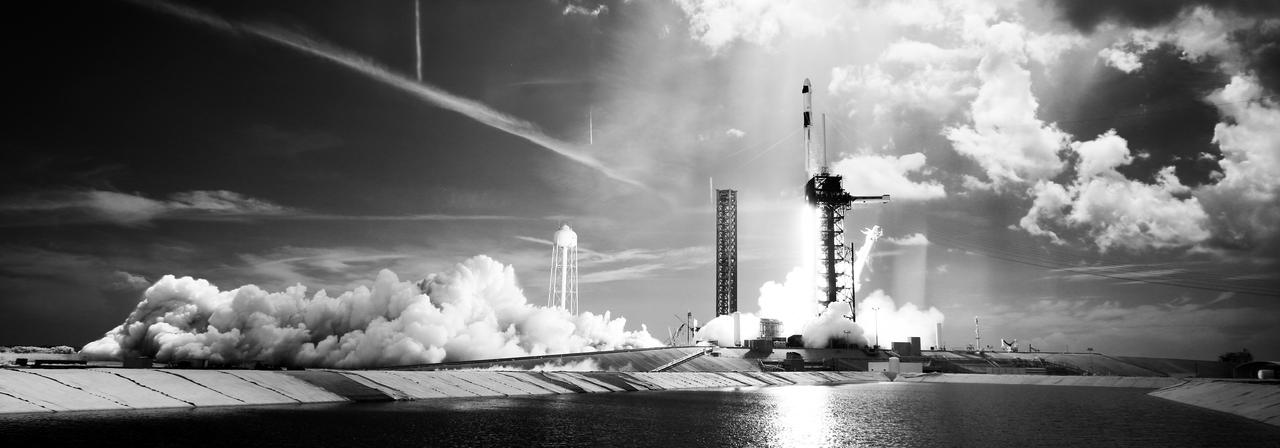 In this black and white infrared image, a SpaceX Falcon 9 rocket carrying the company's Dragon spacecraft is launched on NASA’s SpaceX Crew-11 mission to the International Space Station with NASA astronauts Zena Cardman, Mike Fincke, JAXA (Japan Aerospace Exploration Agency) astronaut Kimiya Yui, and Roscosmos cosmonaut Oleg Platonov onboard, Friday, Aug. 1, 2025, from NASA's Kennedy Space Center in Florida. NASA’s SpaceX Crew-11 mission is the eleventh crew rotation mission of the SpaceX Dragon spacecraft and Falcon 9 rocket to the International Space Station as part of the agency’s Commercial Crew Program. Cardman, Fincke, Yui, Platonov launched at 11:43 a.m. EDT from Launch Complex 39A at the NASA's Kennedy Space Center to begin a six month mission aboard the orbital outpost. Photo Credit: (NASA/Joel Kowsky)