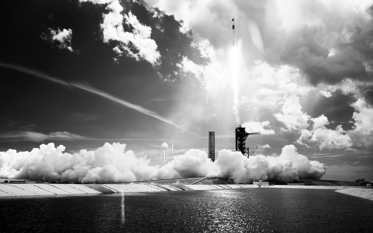 In this black and white infrared image, a SpaceX Falcon 9 rocket carrying the company's Dragon spacecraft is launched on NASA’s SpaceX Crew-11 mission to the International Space Station with NASA astronauts Zena Cardman, Mike Fincke, JAXA (Japan Aerospace Exploration Agency) astronaut Kimiya Yui, and Roscosmos cosmonaut Oleg Platonov onboard, Friday, Aug. 1, 2025, from NASA's Kennedy Space Center in Florida. NASA’s SpaceX Crew-11 mission is the eleventh crew rotation mission of the SpaceX Dragon spacecraft and Falcon 9 rocket to the International Space Station as part of the agency’s Commercial Crew Program. Cardman, Fincke, Yui, Platonov launched at 11:43 a.m. EDT from Launch Complex 39A at the NASA's Kennedy Space Center to begin a six month mission aboard the orbital outpost. Photo Credit: (NASA/Joel Kowsky)