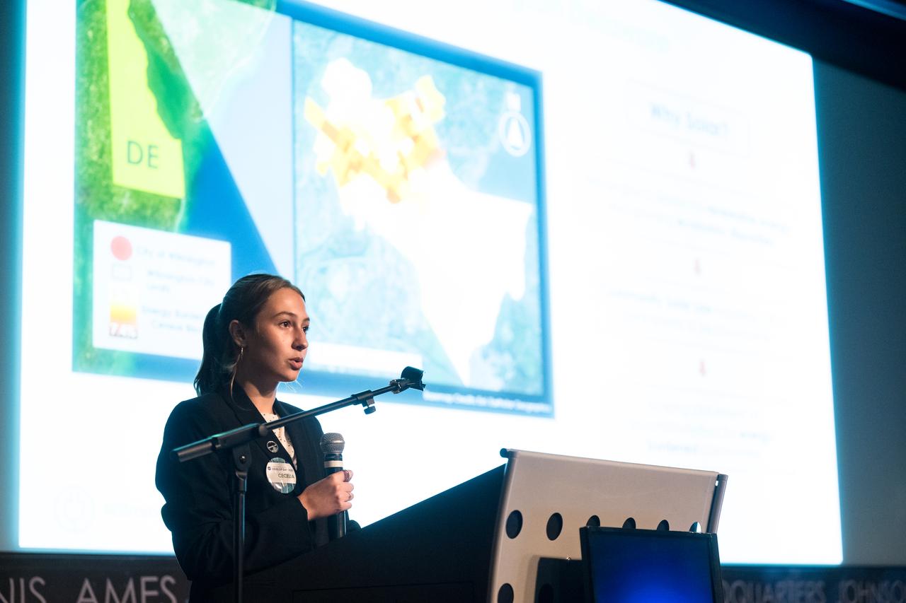 Cecelia Paparella provides remarks about her DEVELOP Project, Tuesday, August 6, 2024, at the Mary W. Jackson NASA Headquarters building in Washington. Every summer early career researchers from NASA’s DEVELOP National Program come to NASA Headquarters and present their research projects. DEVELOP is a training and development program where early career researchers work on Earth science projects, mentored by science advisors from NASA and partner agencies, and provide research results to local communities. Photo Credit: (NASA/Aubrey Gemignani)