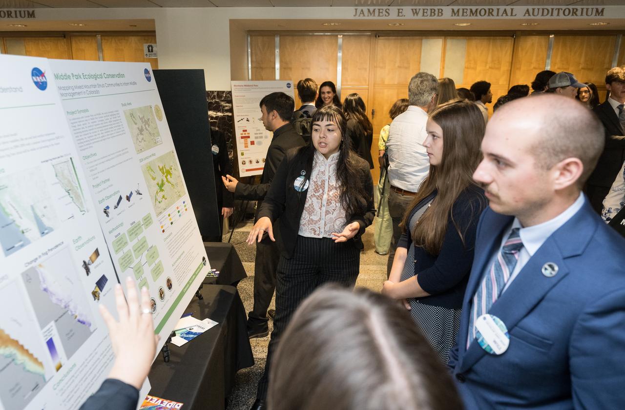 Students and young professionals share the results of their DEVELOP Project, Tuesday, August 5, 2025, at the Mary W. Jackson NASA Headquarters building in Washington. Every summer early career researchers from NASA’s DEVELOP National Program come to NASA Headquarters and present their research projects. DEVELOP is a training and development program where early career researchers work on Earth science projects, mentored by science advisors from NASA and partner agencies, and provide research results to local communities. Photo Credit: (NASA/Aubrey Gemignani)