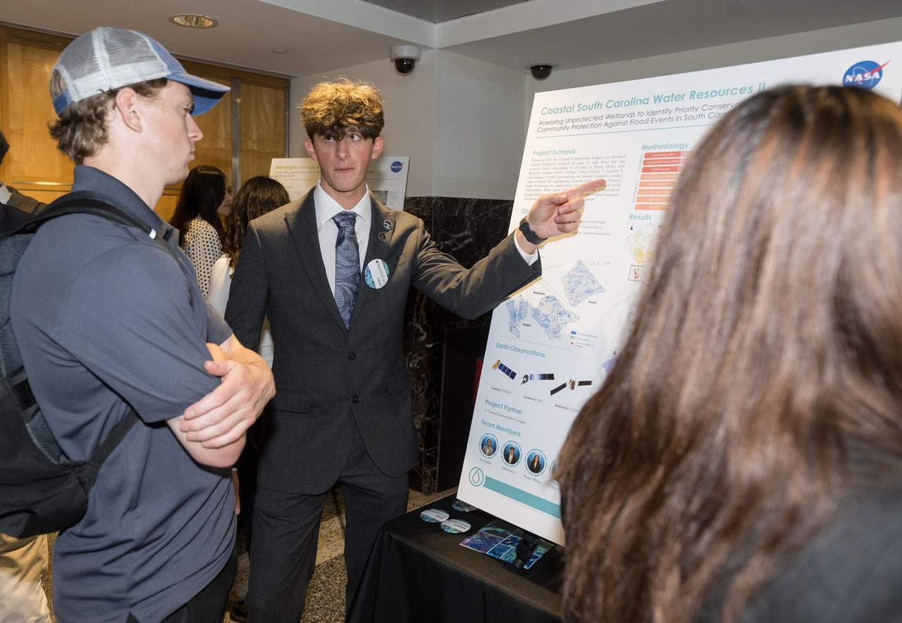 Students and young professionals share the results of their DEVELOP Project, Tuesday, August 5, 2025, at the Mary W. Jackson NASA Headquarters building in Washington. Every summer early career researchers from NASA’s DEVELOP National Program come to NASA Headquarters and present their research projects. DEVELOP is a training and development program where early career researchers work on Earth science projects, mentored by science advisors from NASA and partner agencies, and provide research results to local communities. Photo Credit: (NASA/Aubrey Gemignani)