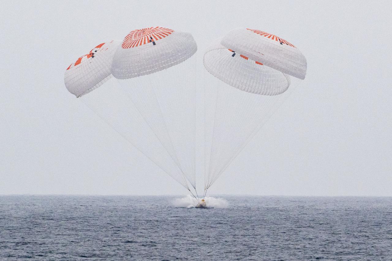 The SpaceX Crew Dragon Endurance spacecraft is seen as it lands with NASA astronauts Anne McClain and Nichole Ayers, JAXA (Japan Aerospace Exploration Agency) astronaut Takuya Onishi, and Roscosmos cosmonaut Kirill Peskov aboard in the Pacific Ocean off the coast of San Diego, Calif., Saturday, Aug. 9, 2025. McClain, Ayers, Onishi, and Peskov are returning after 147 days in space as part of Expedition 73 aboard the International Space Station. Photo Credit: (NASA/Keegan Barber)