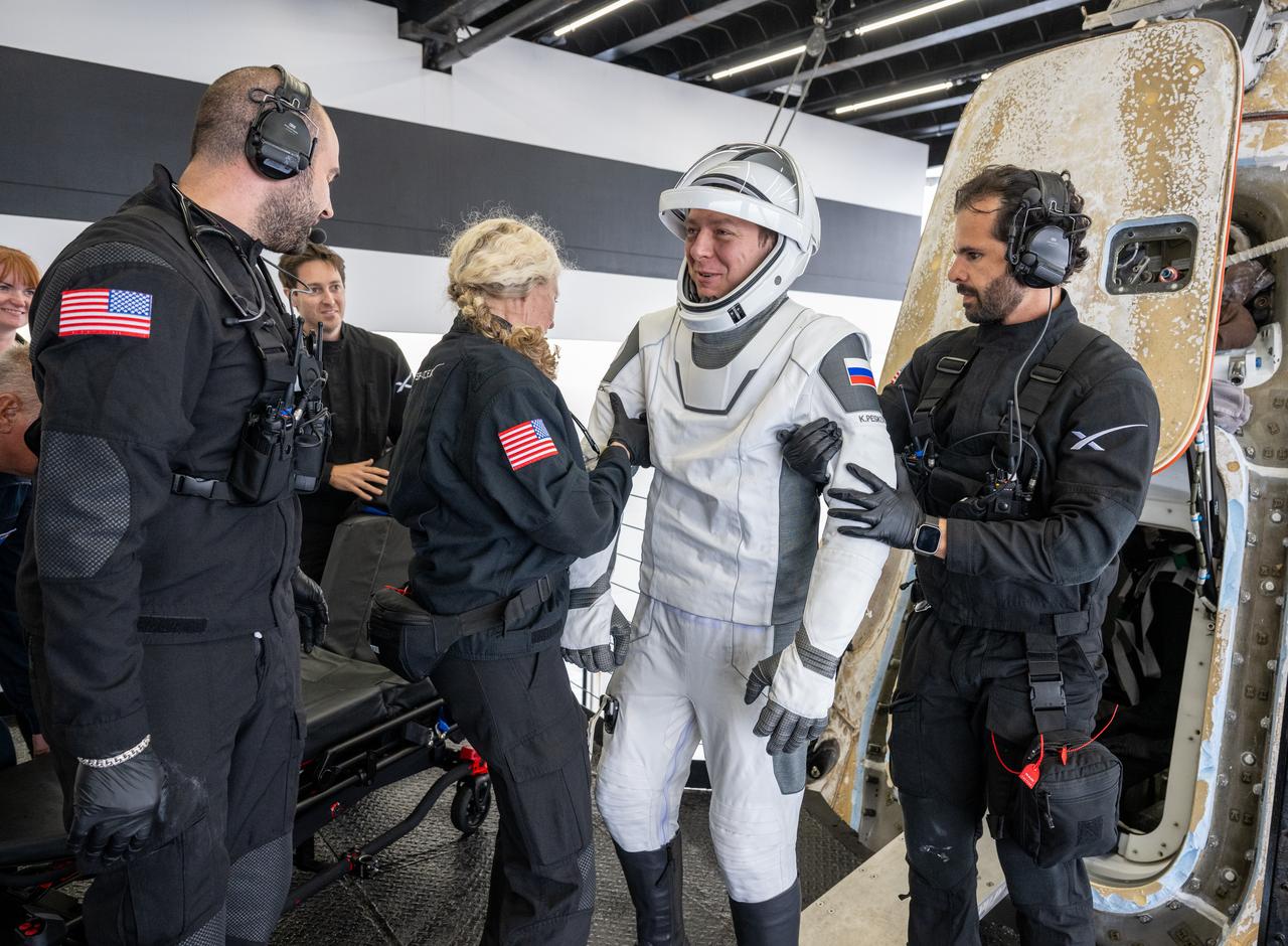 Roscosmos cosmonaut Kirill Peskov is helped out of the SpaceX Dragon Endurance spacecraft onboard the SpaceX recovery ship SHANNON after he, NASA astronauts Nichole Ayers, Anne McClain and JAXA (Japan Aerospace Exploration Agency) astronaut Takuya Onishi landed in the Pacific Ocean off the coast of San Diego, Calif., Saturday, Aug. 9, 2025. McClain, Ayers, Onishi, and Peskov are returning after 147 days in space as part of Expedition 73 aboard the International Space Station. Photo Credit: (NASA/Keegan Barber)\