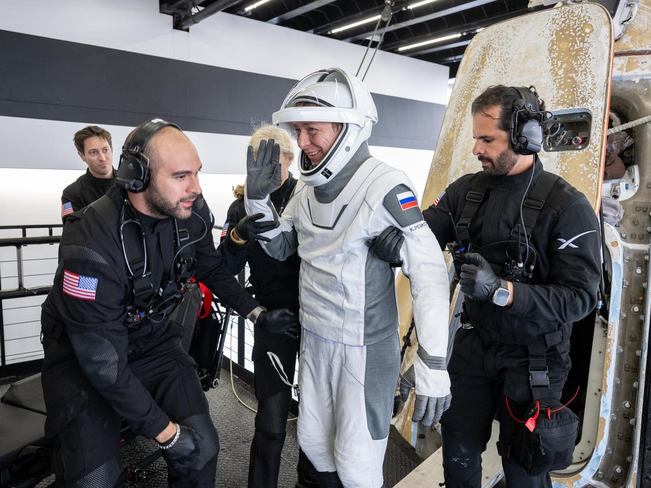 Roscosmos cosmonaut Kirill Peskov is helped out of the SpaceX Dragon Endurance spacecraft onboard the SpaceX recovery ship SHANNON after he, NASA astronauts Nichole Ayers, Anne McClain and JAXA (Japan Aerospace Exploration Agency) astronaut Takuya Onishi landed in the Pacific Ocean off the coast of San Diego, Calif., Saturday, Aug. 9, 2025. McClain, Ayers, Onishi, and Peskov are returning after 147 days in space as part of Expedition 73 aboard the International Space Station. Photo Credit: (NASA/Keegan Barber)\