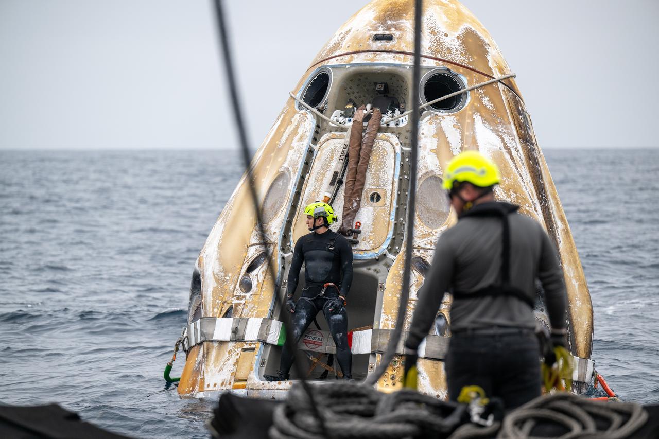 Support teams work around the SpaceX Dragon Endurance spacecraft shortly after it landed with NASA astronauts Anne McClain and Nichole Ayers, JAXA (Japan Aerospace Exploration Agency) astronaut Takuya Onishi, and Roscosmos cosmonaut Kirill Peskov aboard in the Pacific Ocean off the coast of San Diego, Calif., Saturday, Aug. 9,2025. McClain, Ayers, Onishi, and Peskov are returning after 147 days in space as part of Expedition 73 aboard the International Space Station. Photo Credit: (NASA/Keegan Barber)