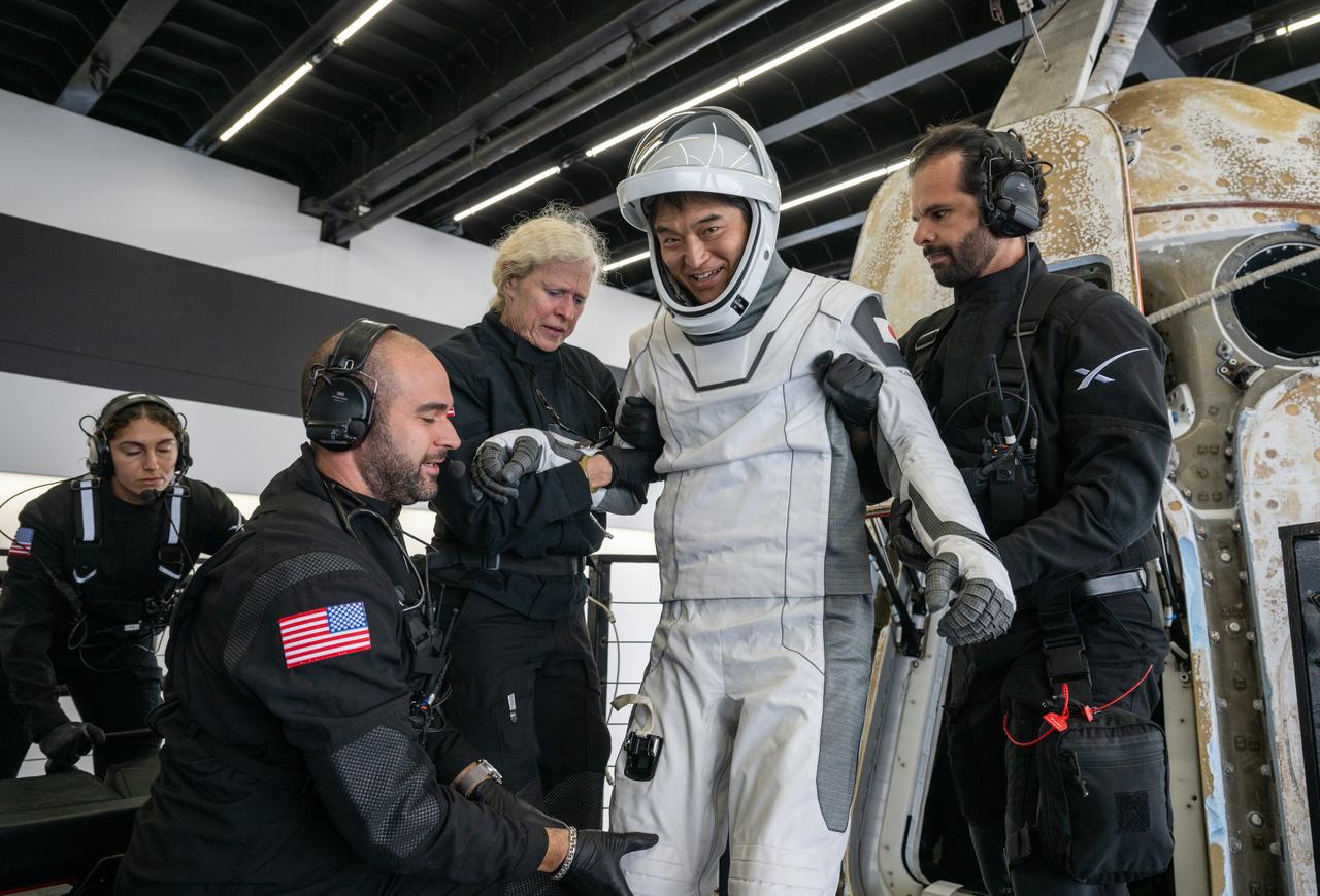 JAXA (Japan Aerospace Exploration Agency) astronaut Takuya Onishi is helped out of the SpaceX Dragon Endurance spacecraft onboard the SpaceX recovery ship SHANNON after he, NASA astronauts Nichole Ayers, Anne McClain, and Roscosmos cosmonaut Kirill Peskov landed in the Pacific Ocean off the coast of San Diego, Calif., Saturday, Aug. 9, 2025. McClain, Ayers, Onishi, and Peskov are returning after 147 days in space as part of Expedition 73 aboard the International Space Station. Photo Credit: (NASA/Keegan Barber)