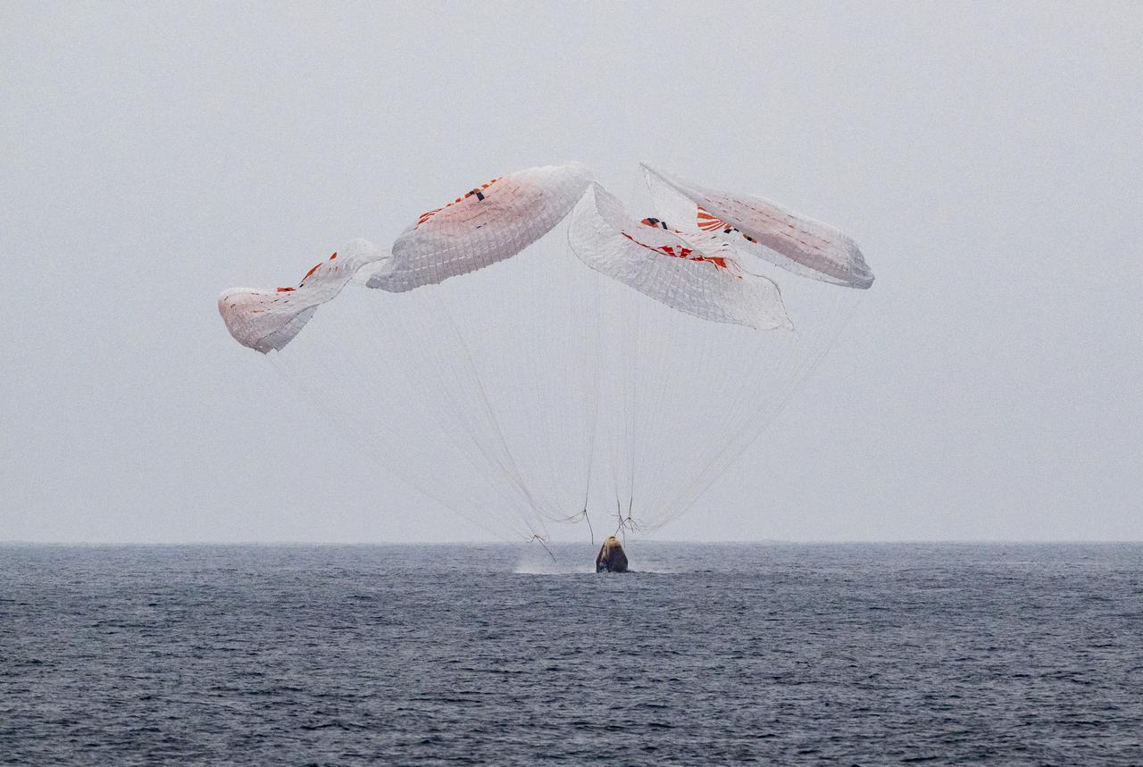 The SpaceX Crew Dragon Endurance spacecraft is seen as it lands with NASA astronauts Anne McClain and Nichole Ayers, JAXA (Japan Aerospace Exploration Agency) astronaut Takuya Onishi, and Roscosmos cosmonaut Kirill Peskov aboard in the Pacific Ocean off the coast of San Diego, Calif., Saturday, Aug. 9, 2025. McClain, Ayers, Onishi, and Peskov are returning after 147 days in space as part of Expedition 73 aboard the International Space Station. Photo Credit: (NASA/Keegan Barber)