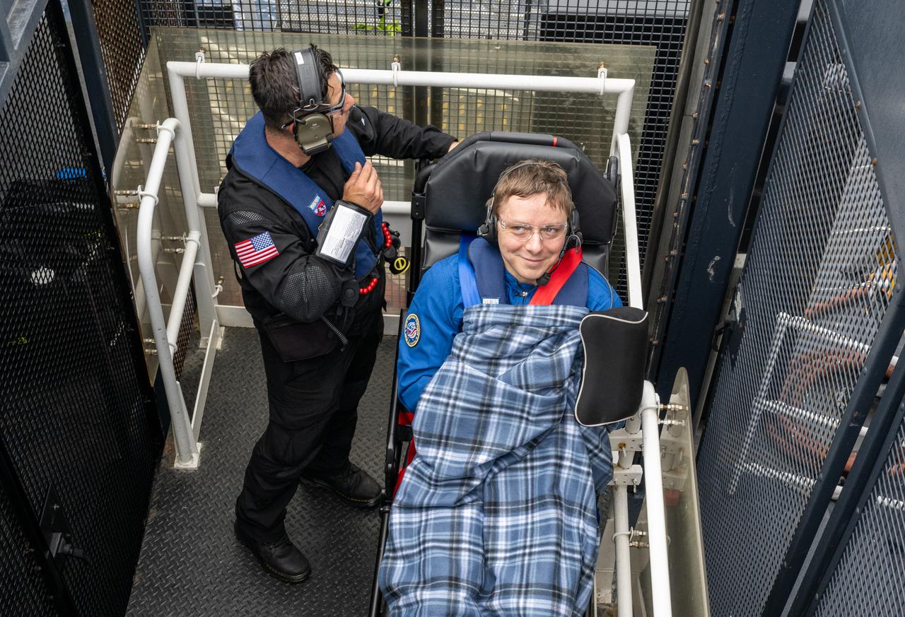 Roscosmos cosmonaut Kirill Peskov is seen inside an elevator onboard the SpaceX recovery ship SHANNON that will take him up to a waiting helicopter to fly to Long Beach, Calif. along with NASA astronauts Nichole Ayers, Anne McClain and JAXA (Japan Aerospace Exploration Agency) astronaut Takuya Onishi shortly after they landed in the Pacific Ocean off the coast of San Diego, Calif., Saturday, Aug. 9, 2025. McClain, Ayers, Onishi, and Peskov are returning after 147 days in space as part of Expedition 73 aboard the International Space Station. Photo Credit: (NASA/Keegan Barber)