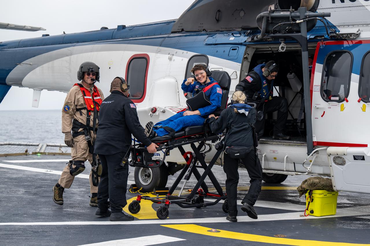 NASA astronaut Anne McClain is helped aboard a helicopter on the SpaceX recovery ship SHANNON to fly to Long Beach, Calif. along with NASA astronaut Nichole Ayers, JAXA (Japan Aerospace Exploration Agency) astronaut Takuya Onishi, and Roscosmos cosmonaut Kirill Peskov shortly after they landed in the Pacific Ocean off the coast of San Diego, Calif., Saturday, Aug. 9, 2025. McClain, Ayers, Onishi, and Peskov are returning after 147 days in space as part of Expedition 73 aboard the International Space Station. Photo Credit: (NASA/Keegan Barber)