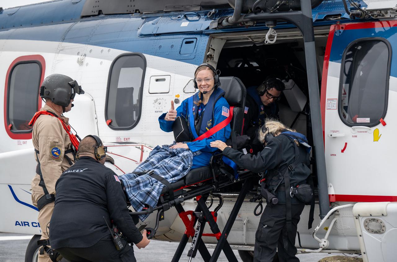 NASA astronaut Nichole Ayers is helped aboard a helicopter on the SpaceX recovery ship SHANNON to fly to Long Beach, Calif. along with NASA astronaut Anne McClain, JAXA (Japan Aerospace Exploration Agency) astronaut Takuya Onishi, and Roscosmos cosmonaut Kirill Peskov shortly after they landed in the Pacific Ocean off the coast of San Diego, Calif., Saturday, Aug. 9, 2025. McClain, Ayers, Onishi, and Peskov are returning after 147 days in space as part of Expedition 73 aboard the International Space Station. Photo Credit: (NASA/Keegan Barber)