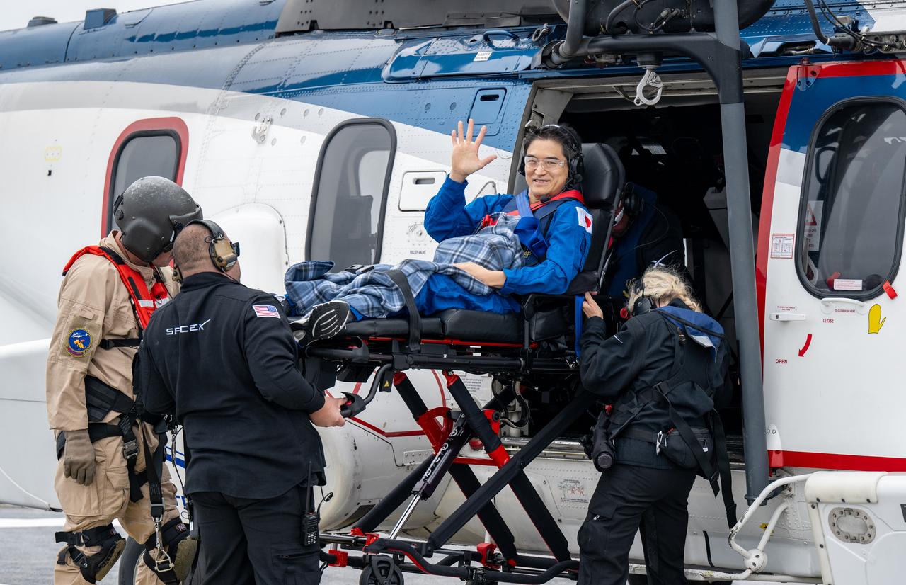 JAXA (Japan Aerospace Exploration Agency) astronaut Takuya Onishi is helped aboard a helicopter on the SpaceX recovery ship SHANNON to fly to Long Beach, Calif. along with NASA astronaut Nichole Ayers, Anne McClain, and Roscosmos cosmonaut Kirill Peskov shortly after they landed in the Pacific Ocean off the coast of San Diego, Calif., Saturday, Aug. 9, 2025. McClain, Ayers, Onishi, and Peskov are returning after 147 days in space as part of Expedition 73 aboard the International Space Station. Photo Credit: (NASA/Keegan Barber)