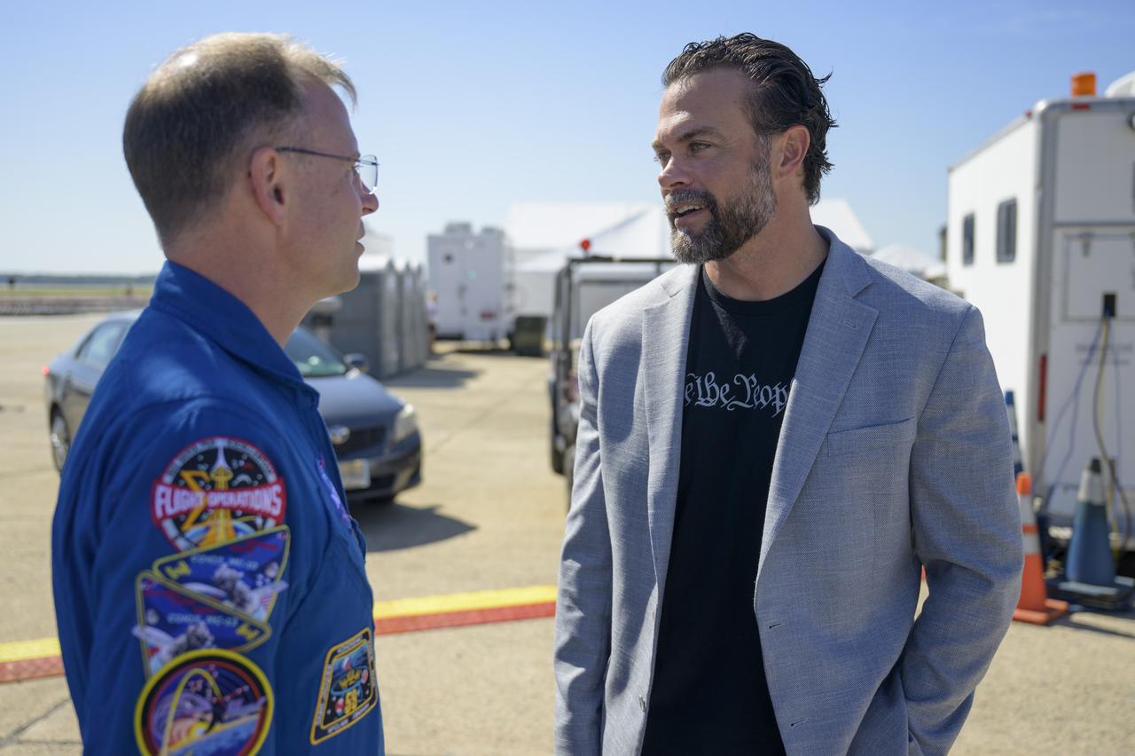 NASA astronaut Nick Hague, left, talks with Under Secretary of the Air Force Matthew Lohmeier, Friday, Sept. 12, 2025, during the Joint Base Andrews Air Show at Joint Base Andrews in Prince George's County, Maryland. Hague spent 171 days onboard the International Space Station as part of Expedition 72. Photo Credit: (NASA/Bill Ingalls)