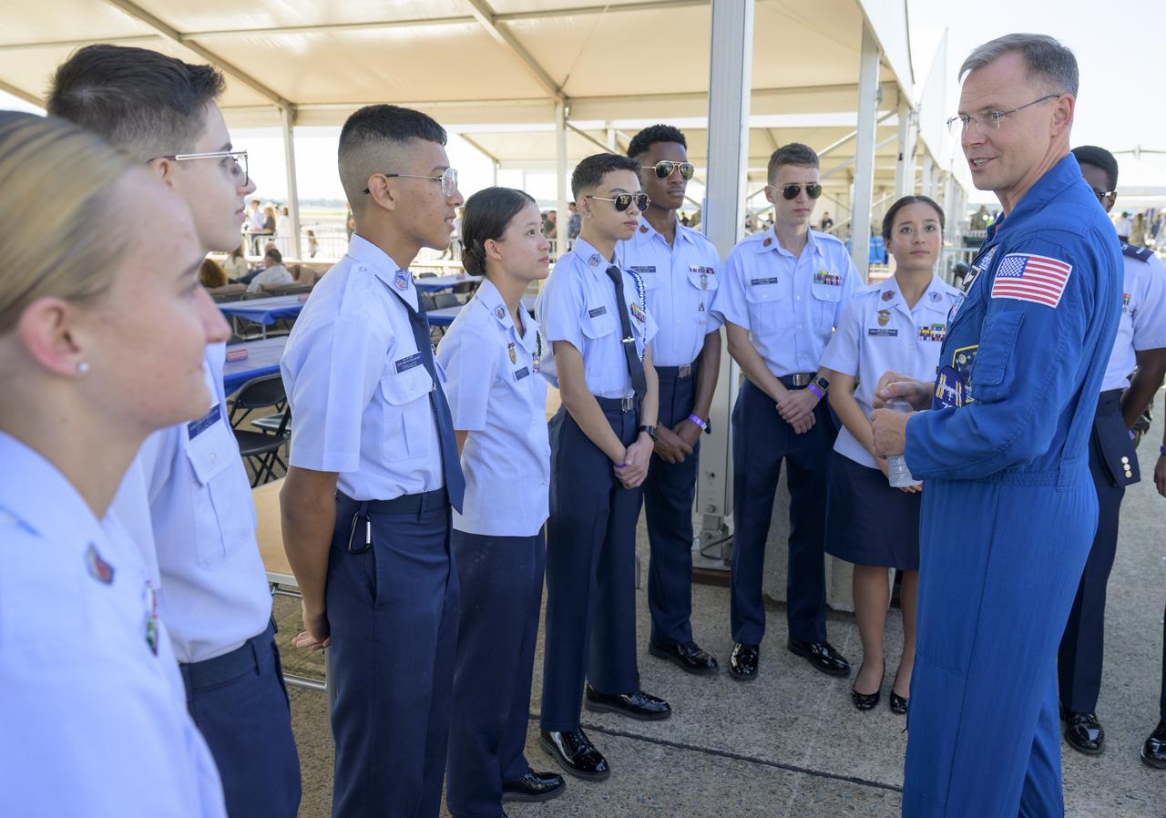 NASA astronaut Nick Hague talks with members of the Civil Air Patrol, Friday, Sept. 12, 2025, during the Joint Base Andrews Air Show at Joint Base Andrews in Prince George's County, Maryland. Hague spent 171 days onboard the International Space Station as part of Expedition 72. Photo Credit: (NASA/Bill Ingalls)
