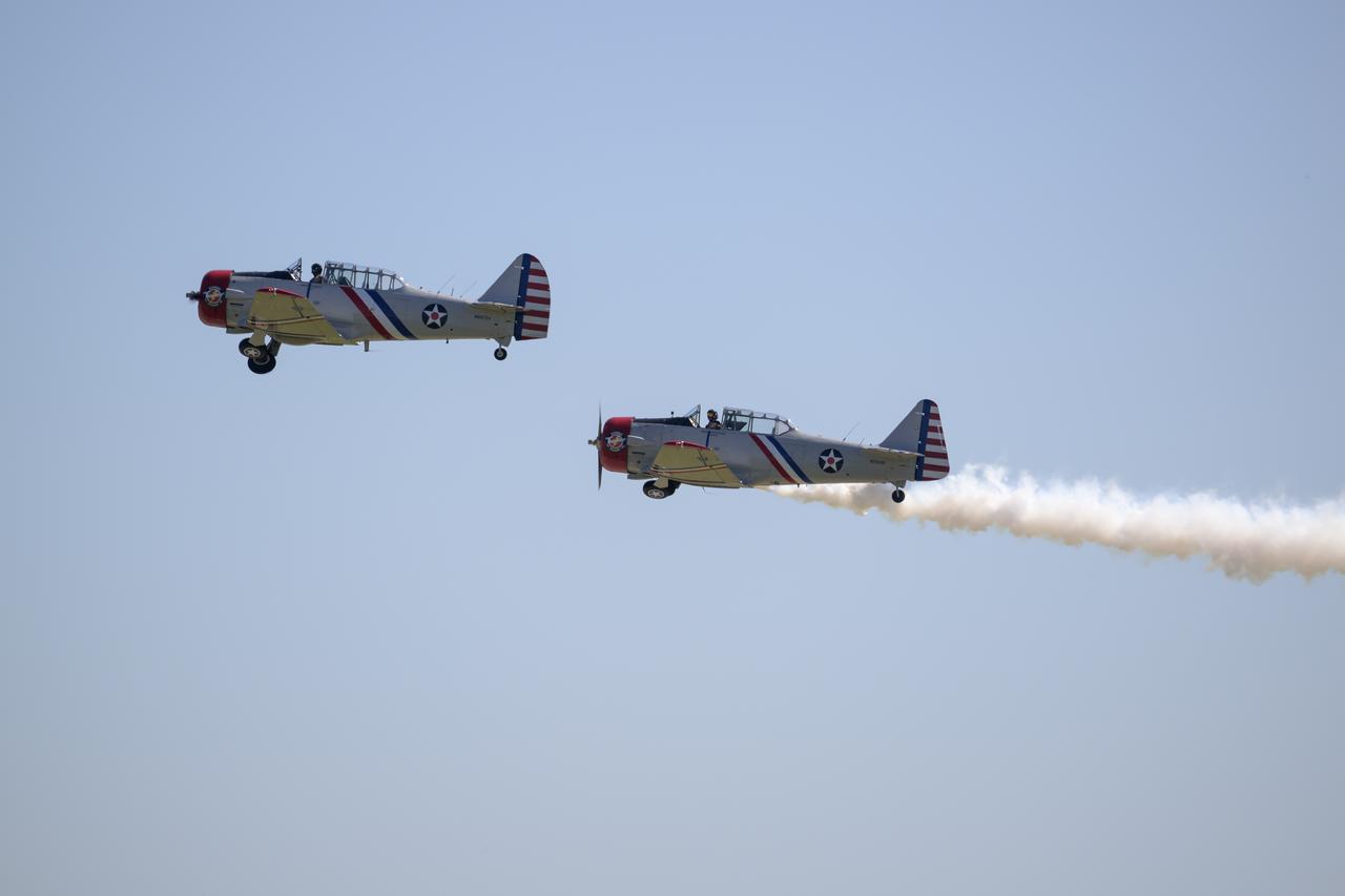 Warbird Thunder SNJ planes perform, Friday, Sept. 12, 2025, during the Joint Base Andrews Air Show at Joint Base Andrews in Prince George's County, Maryland. NASA astronaut Nick Hague was on hand to provide remarks and meet with guests. Hague spent 171 days onboard the International Space Station as part of Expedition 72. Photo Credit: (NASA/Bill Ingalls)