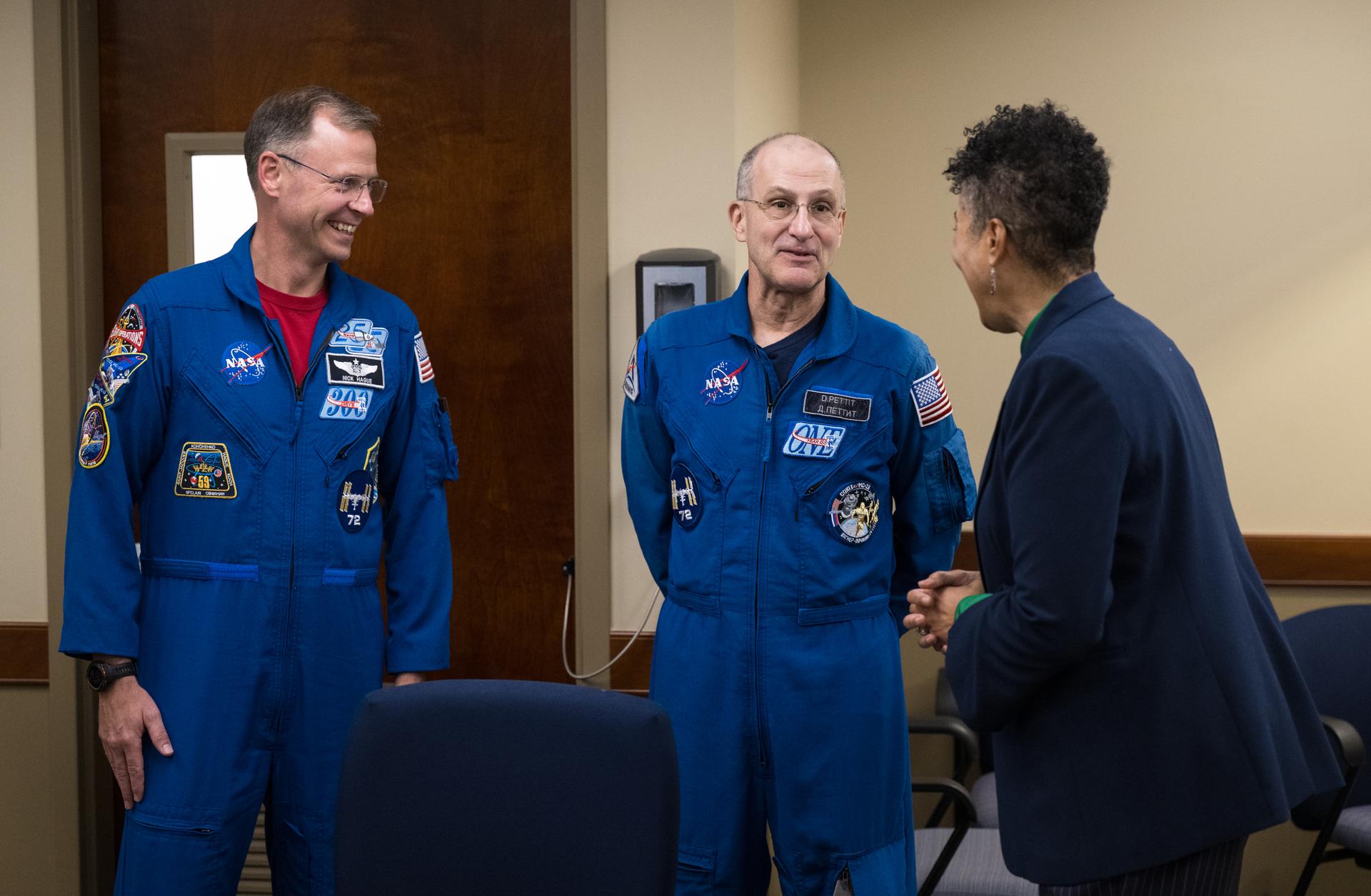 NASA astronauts Nick Hague, left, and Don Pettit speak to Cynthia Simmons, acting center director of NASA's Goddard Space Flight Center, before a Silver Snoopy award presentation, Wednesday, Sept. 17, 2025, at NASA’s Goddard Space Flight Center in Greenbelt, Md. Pettit and Hague served as part of Expedition 72 onboard the International Space Station. Photo Credit: (NASA/Aubrey Gemignani)