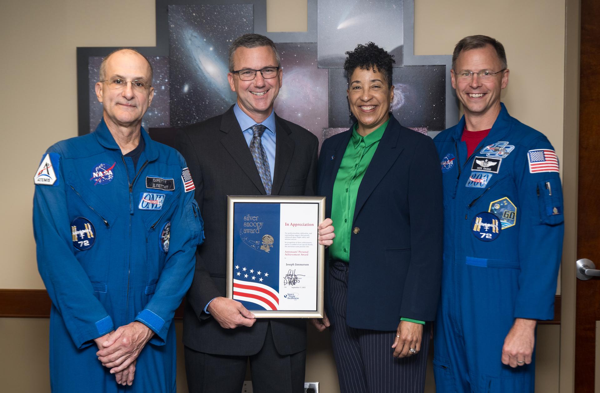 NASA astronauts Don Pettit, left, and Nick Hague, right, pose for a photo with Silver Snoopy awardee, NASA Range Operations Contract Engineer Manager at Wallops Flight Facility, Joseph Jimmerson, second from left, and Cynthia Simmons, acting center director of NASA's Goddard Space Flight Center, second from right, Wednesday, Sept. 17, 2025, at NASA’s Goddard Space Flight Center in Greenbelt, Md. Pettit and Hague served as part of Expedition 72 onboard the International Space Station. Photo Credit: (NASA/Aubrey Gemignani)