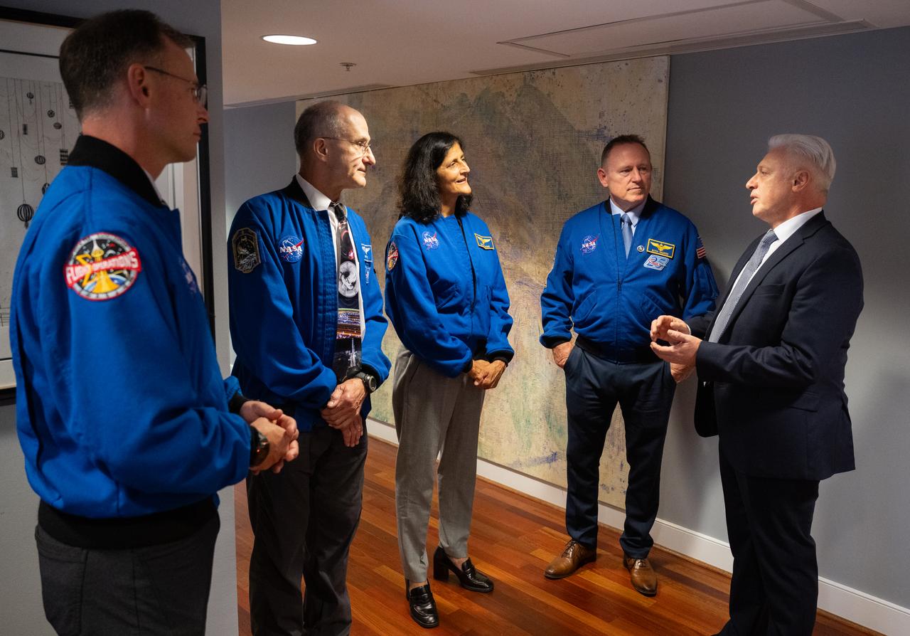 Expedition 72 NASA astronauts Nick Hague, left, Don Pettit, Suni Williams, and Butch Wilmore speak with Iztok Mirošič, Ambassador of the Republic of Slovenia to the United States, center, prior to a panel discussion at the Embassy of Slovenia,  Wednesday, Sept. 17, 2025, in Washington. Hague, Wilmore, Williams, and Pettit served as part of Expedition 72 onboard the International Space Station.  Photo Credit: (NASA/Joel Kowsky)