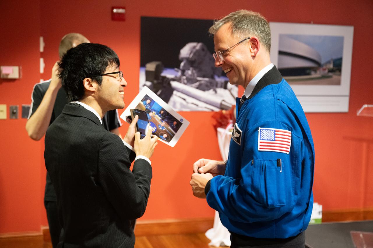 NASA astronaut Nick Hague speaks with an attendee following a panel discussion at the Embassy of Slovenia, Wednesday, Sept. 17, 2025, in Washington. Hague and fellow NASA astronauts Suni Williams, Butch Wilmore, and Don Pettit served as part of Expedition 72 onboard the International Space Station. Photo Credit: (NASA/Joel Kowsky)
