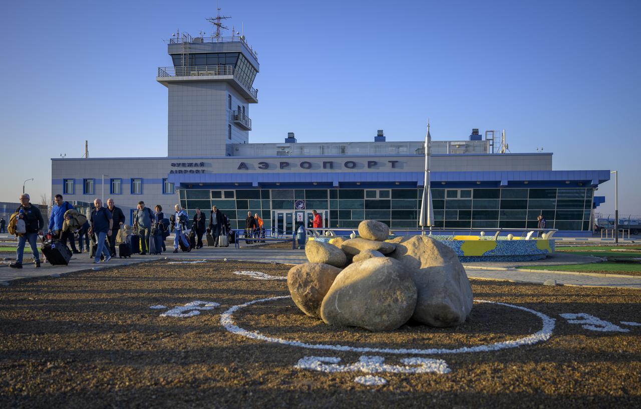 NASA team members arrive at the Krayniy Airport in Baikonur, Kazakhstan in advance of the launch of Expedition 74 crewmembers: NASA astronaut Chris Williams, Roscosmos cosmonauts Sergey Kud-Sverchkov and Sergey Mikaev Sunday, Nov. 23, 2025. Williams, Kud-Sverchkov, and Mikaev are scheduled to launch to the International Space Station on November 27. Photo Credit: (NASA/Bill Ingalls)