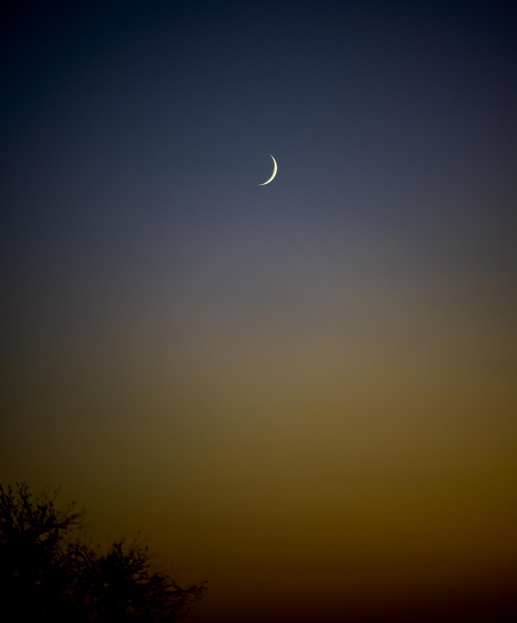 The Moon is seen from Baikonur, Kazakhstan Sunday, Nov. 23, 2025 shortly after NASA tams arrived in advance of the launch of Expedition 74 crewmembers: NASA astronaut Chris Williams, Roscosmos cosmonauts Sergey Kud-Sverchkov and Sergey Mikaev. The trio are scheduled to launch to the International Space Station on November 27. Photo Credit: (NASA/Bill Ingalls)