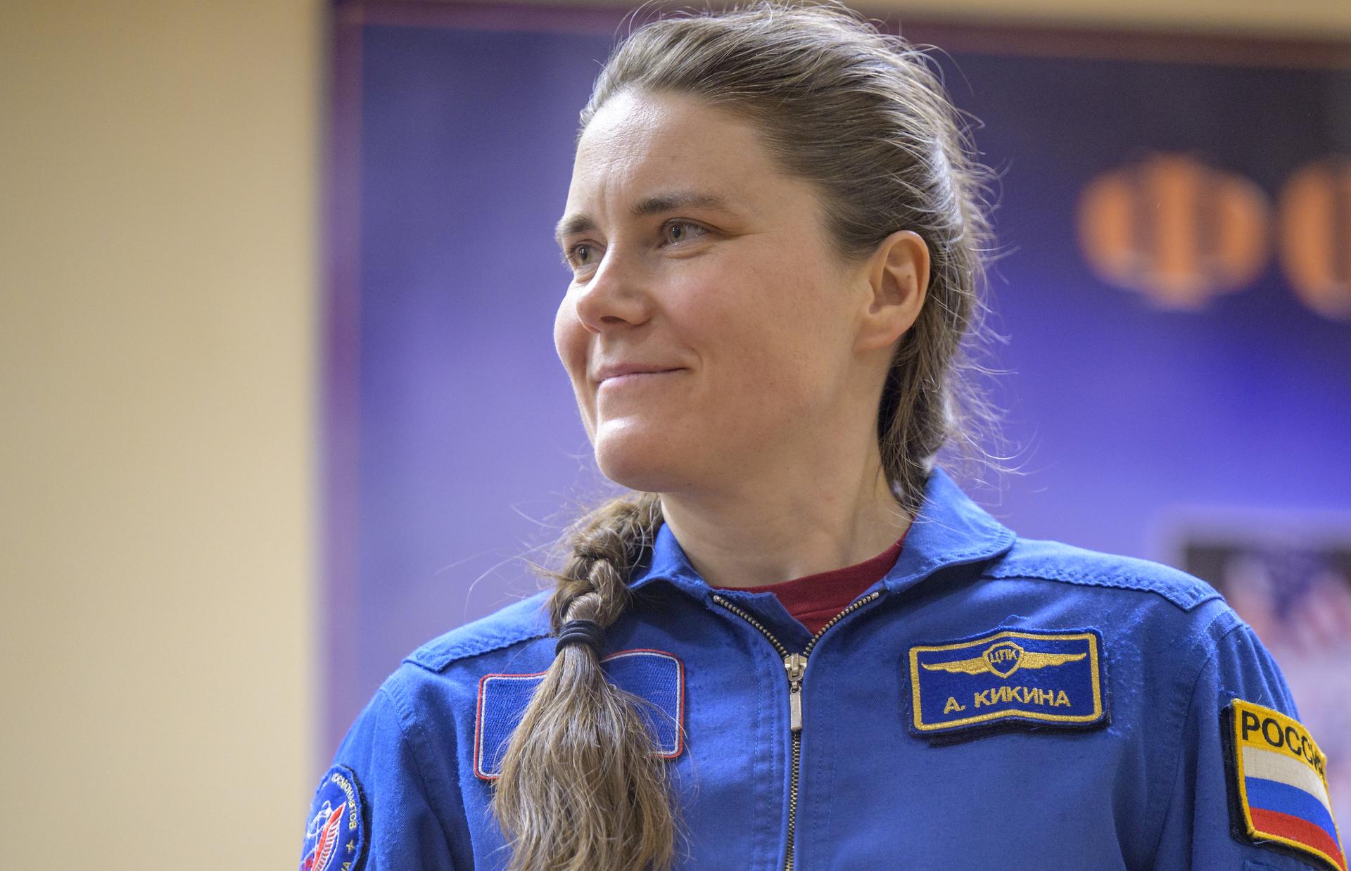 Expedition 74 backup crew member Anna Kikina of Roscosmos is seen in quarantine, behind glass, during a press conference, Wednesday, Nov. 26, 2025 at the Cosmonaut Hotel in Baikonur, Kazakhstan. Expedition 74 crewmembers: NASA astronaut Chris Williams, Roscosmos cosmonauts Sergey Kud-Sverchkov and Sergei Mikaev, are scheduled to launch aboard their Soyuz MS-28 spacecraft on November 27. Photo Credit: (NASA/Bill Ingalls)
