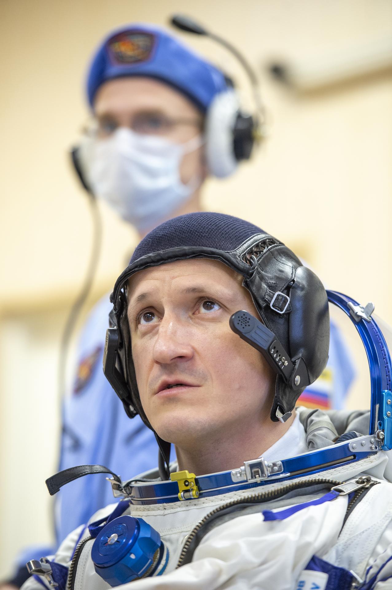 Roscosmos cosmonaut Sergey Kud-Sverchkov is helped into his Russian Sokol suit as he and fellow crewmates, NASA astronaut Chris Williams, and Roscosmos cosmonaut Sergei Mikaev, prepare for their Soyuz launch to the International Space Station Thursday, Nov. 27, 2025 in Baikonur, Kazakhstan. Photo Credit: (NASA/GCTC/Pavel Shvets)