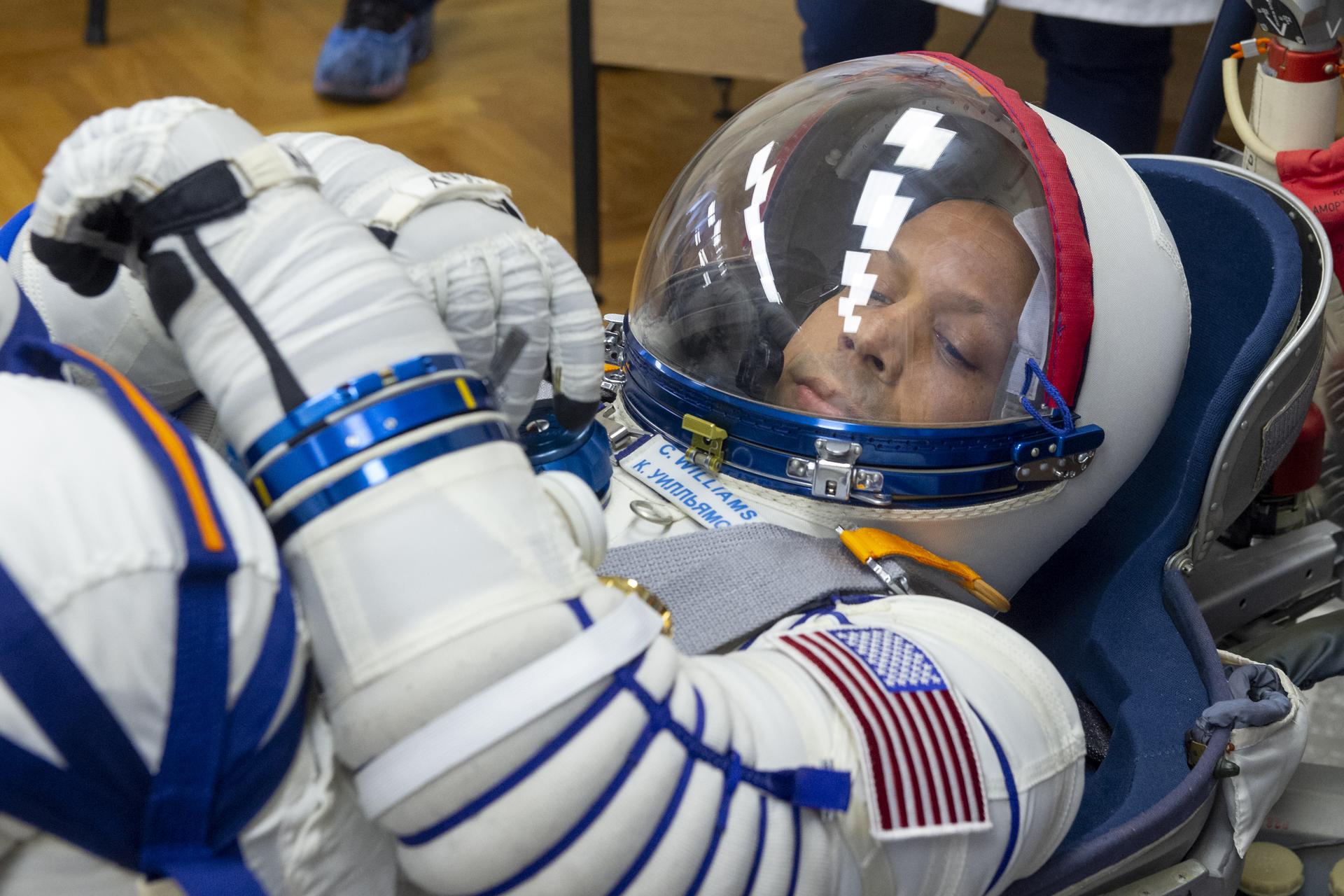 NASA astronaut Chris Williams has his Russian Sokol suit pressure checked as he and fellow crewmates, Roscosmos cosmonauts Sergei Mikaev, and Sergey Kud-Sverchkov, prepare for their Soyuz launch to the International Space Station Thursday, Nov. 27, 2025 in Baikonur, Kazakhstan. Photo Credit: (NASA/GCTC/Pavel Shvets)
