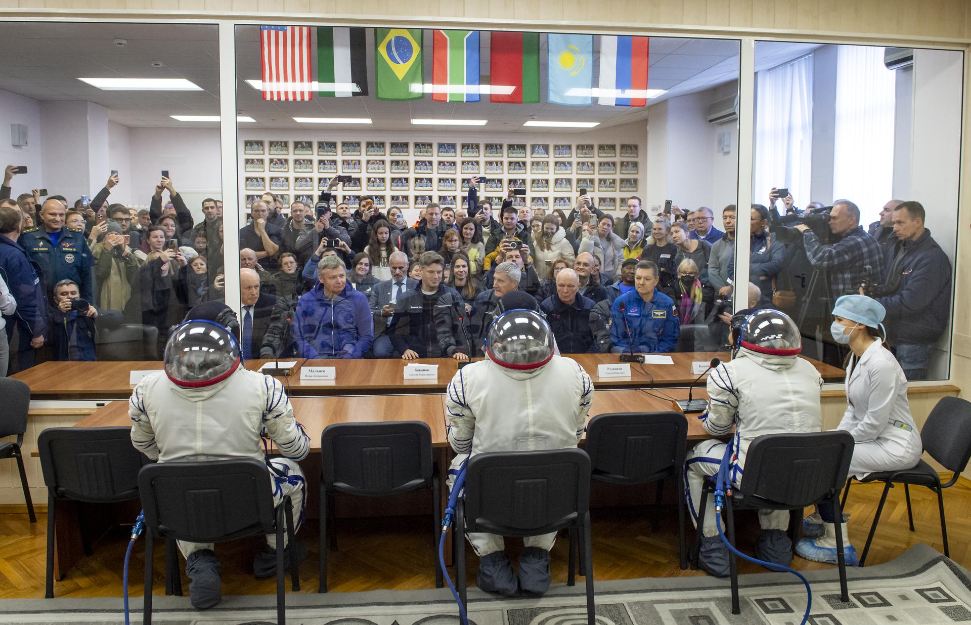Roscosmos cosmonauts Sergei Mikaev, left, Sergey Kud-Sverchkov, and NASA astronaut Chris Williams, right, meet with NASA and Roscosmos management ahead of their Soyuz launch to the International Space Station Thursday, Nov. 27, 2025 in Baikonur, Kazakhstan. Photo Credit: (NASA/GCTC/Pavel Shvets)