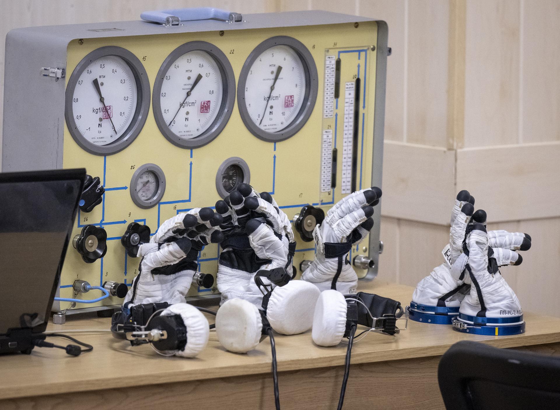 Russian Sokol suit gloves are seen ahead of Expedition 74 crewmates: NASA astronaut Chris Williams, Roscosmos cosmonauts Sergey Kud-Sverchkov, and Sergei Mikaev, having their Sokol suits pressure checked to prepare for their Soyuz launch to the International Space Station Thursday, Nov. 27, 2025 in Baikonur, Kazakhstan. Photo Credit: (NASA/Bill Ingalls)