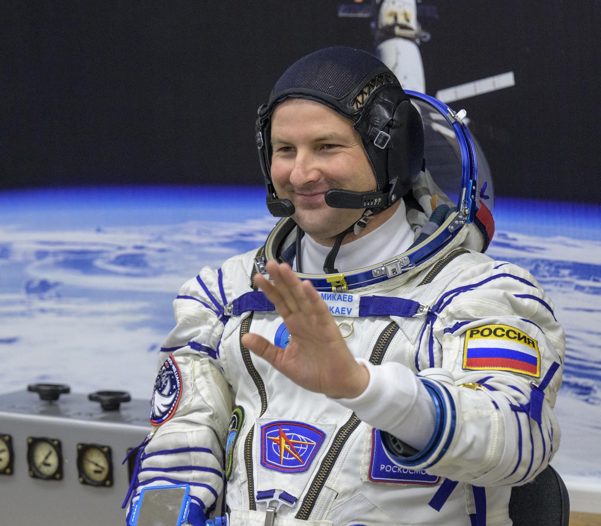 Roscosmos cosmonaut Sergei Mikaev waits to have his Russian Sokol suit pressure checked ahead of his launch on the Soyuz Rocket  to the International Space Station with fellow crewmembers Roscosmos cosmonaut Sergey Kud-Sverchkov, and NASA astronaut Chris Williams, Thursday, Nov. 27, 2025 in Baikonur, Kazakhstan. Photo Credit: (NASA/Bill Ingalls)