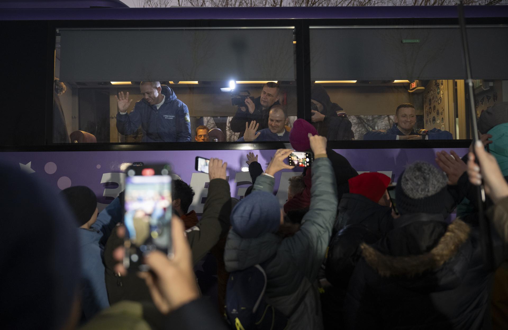 NASA astronaut Chris Williams, left, Roscosmos cosmonauts Sergei Mikaev, and Sergey Kud-Sverchkov, right, depart the Cosmonaut Hotel to suit-up for their Soyuz launch, Thursday, Nov. 27, 2025, in Baikonur, Kazakhstan. The launch will send Williams, Kud-Sverchkov and Mikaev, on a mission to the International Space Station. Photo Credit: (NASA/Bill Ingalls)