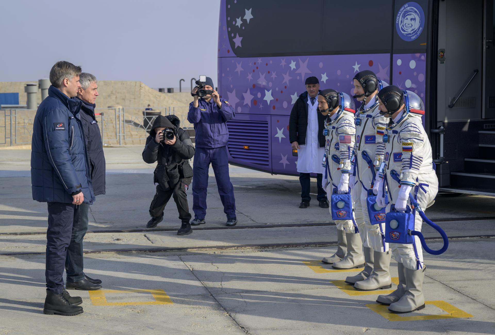 NASA astronaut Chris Williams, left, and Roscosmos cosmonauts Sergey Kud-Sverchkov, and Sergei Mikaev, right, arrive at the launch pad to board the Soyuz MS-28 spacecraft for launch, Thursday, Nov. 27, 2025 at the Baikonur Cosmodrome in Kazakhstan. Launch of the Soyuz rocket will send the trio on a mission to the International Space Station. Photo Credit: (NASA/Bill Ingalls)