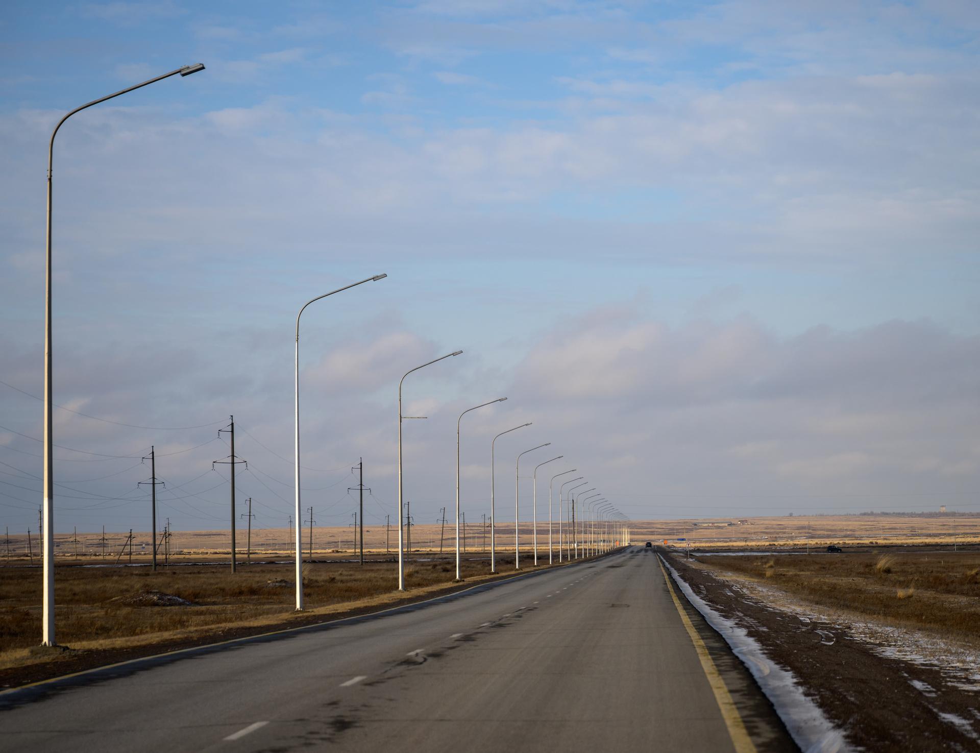 The road from Karaganda Airport in Kazakhstan to the town of Karaganda is seen as NASA, Roscosmos, and Russian Search and Recovery Forces arrive ahead of the landing of Expedition 73 NASA astronaut Jonny Kim, and Roscosmos cosmonauts Sergey Ryzhikov, and Alexey Zubritsky, Saturday, Dec. 6, 2025. The trio are returning to Earth after logging 245 days in space as a members of Expeditions 72 and 73 aboard the International Space Station. Photo Credit: (NASA/Bill Ingalls)