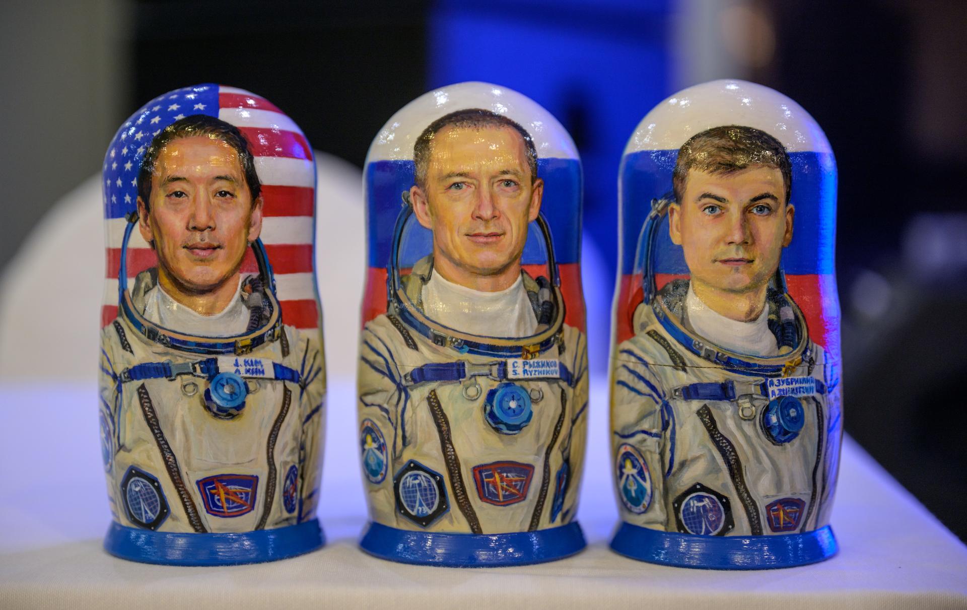 Matryoshka Dolls depicting NASA astronaut Jonny Kim, left, Roscosmos cosmonauts Sergey Ryzhikov, and Alexey Zubritsky, are seen at the Cosmonaut Hotel in Karaganda, Kazakhstan, Sunday, Dec. 7, 2025. The trio are returning to Earth, December 9, after logging 245 days in space as a members of Expeditions 72 and 73 aboard the International Space Station. Photo Credit: (NASA/Bill Ingalls)
