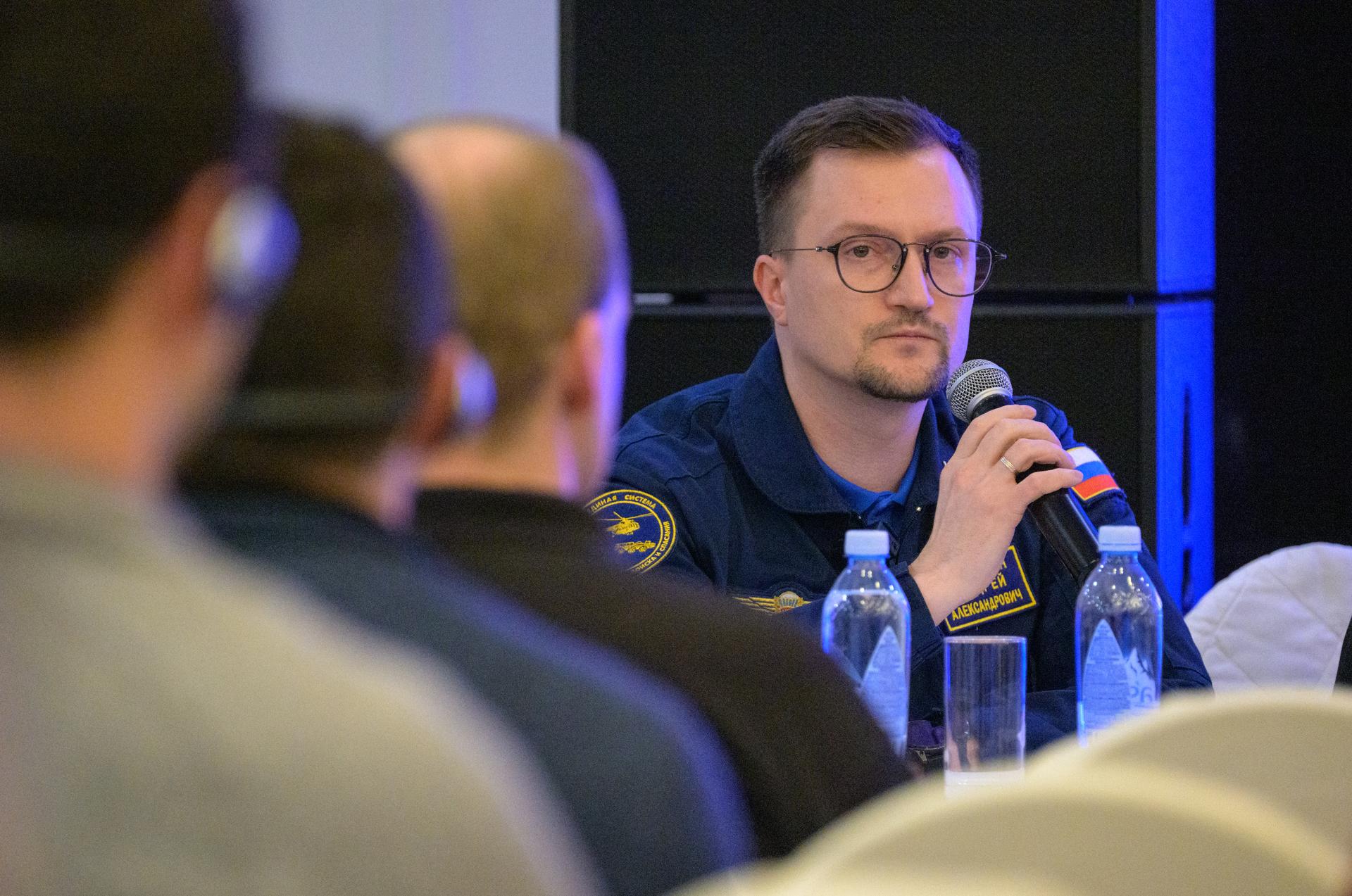 Head of the Search-and-Rescue Department of Rosaviatsiya (Russian Federal Agency for Air Transport) Andrey Aleksandrovich, is seen at the Cosmonaut Hotel in Karaganda, Kazakhstan, Sunday, Dec. 7, 2025, at a meeting to discuss the readiness for the landing of Expedition 73 NASA astronaut Jonny Kim, and Roscosmos cosmonauts Sergey Ryzhikov, and Alexey Zubritsky. Photo Credit: (NASA/Bill Ingalls)