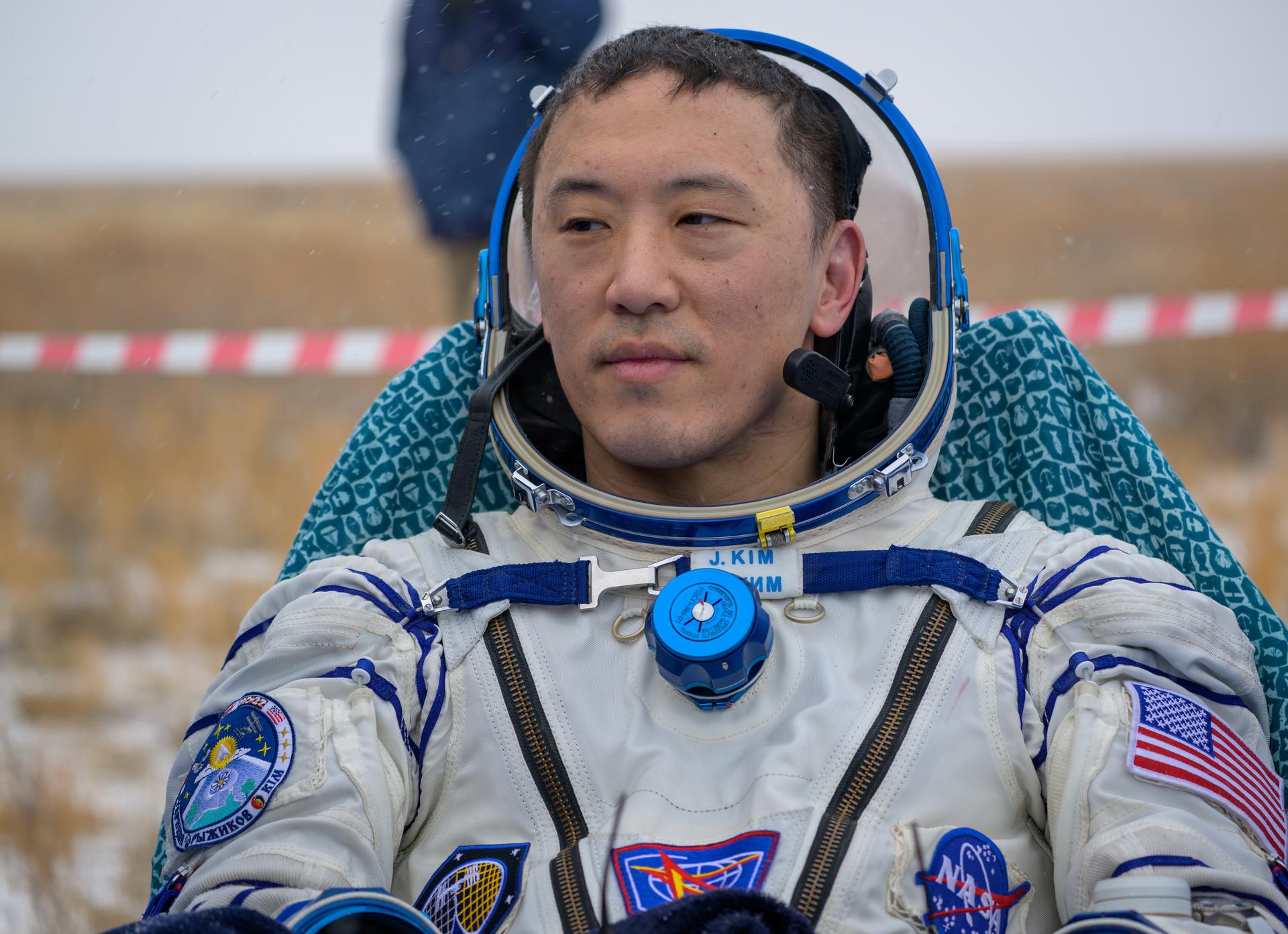 NASA astronaut Jonny Kim is seen outside the Soyuz MS-27 spacecraft after he landed with Roscosmos cosmonauts Sergey Ryzhikov, and Alexey Zubritsky in a remote area near the town of Zhezkazgan, Kazakhstan on Tuesday, Dec. 9, 2025. The trio returned to Earth after logging 245 days in space as a members of Expeditions 72 and 73 aboard the International Space Station. Photo Credit: (NASA/Bill Ingalls)