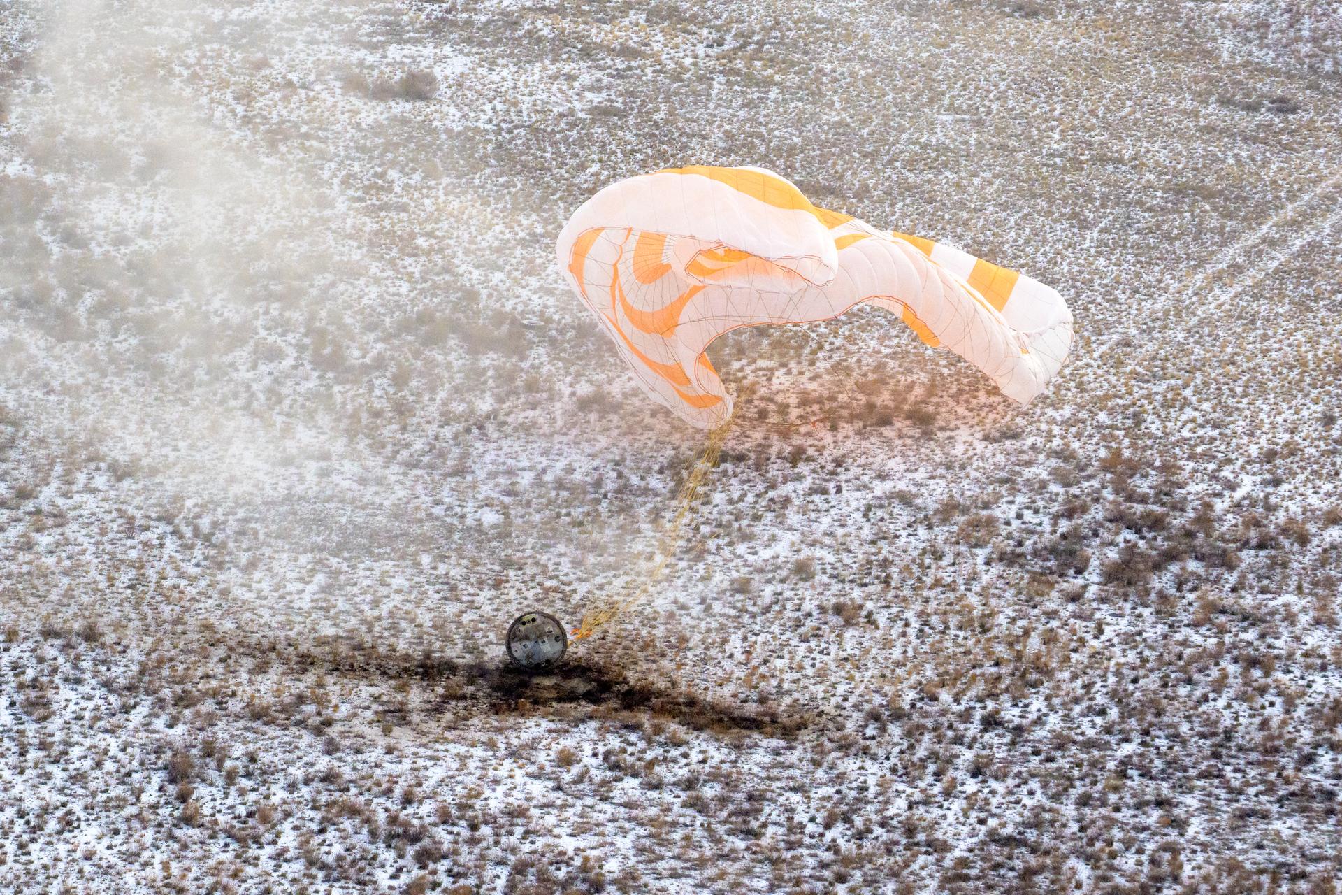 The Soyuz MS-27 spacecraft is seen as it lands in a remote area near the town of Zhezkazgan, Kazakhstan with Expedition 73 NASA astronaut Jonny Kim, and Roscosmos cosmonauts Sergey Ryzhikov, and Alexey Zubritsky aboard, Tuesday, Dec. 9, 2025. The trio are returning to Earth after logging 245 days in space as members of Expeditions 72 and 73 aboard the International Space Station. Photo Credit: (NASA/Bill Ingalls)