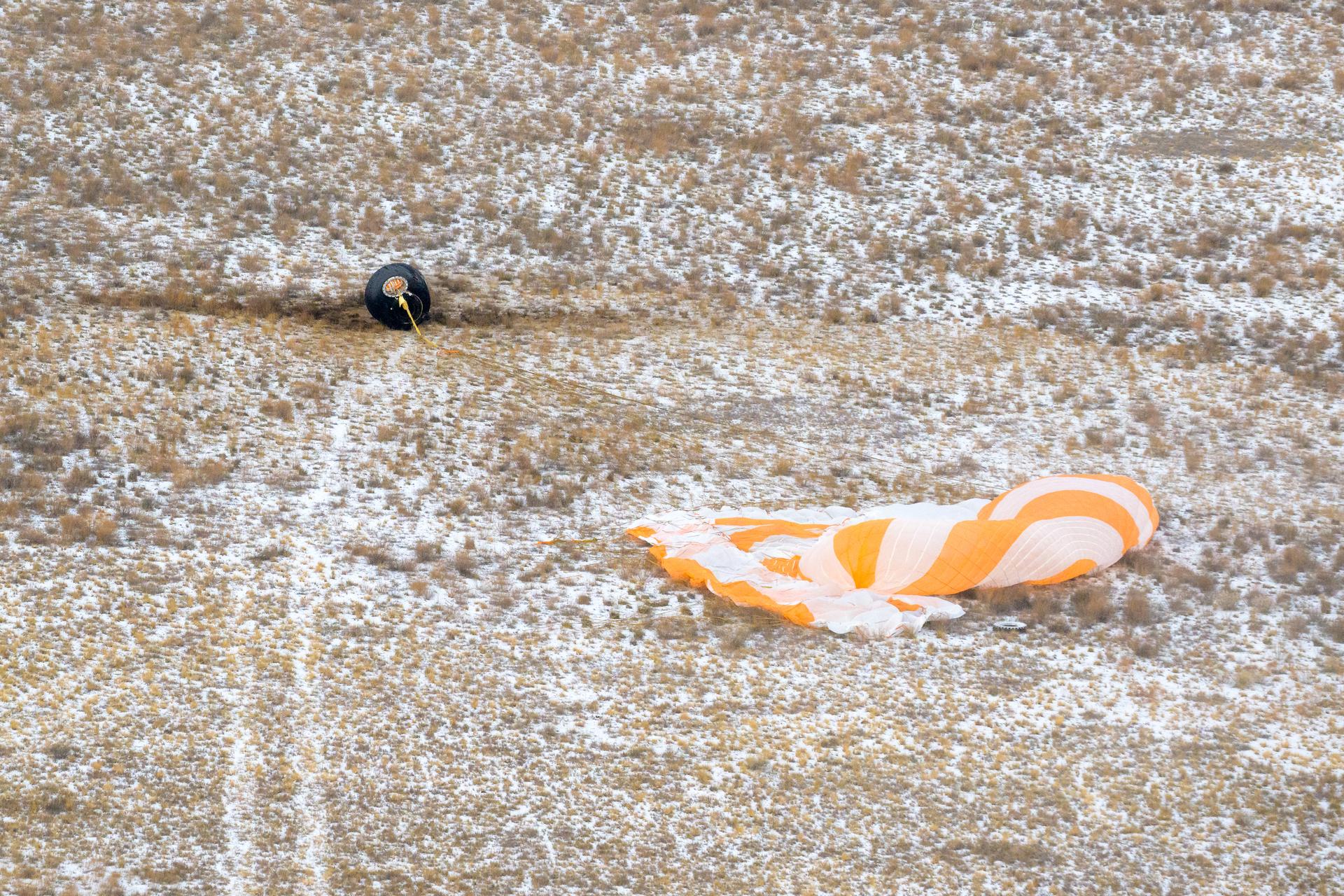 The Soyuz MS-27 spacecraft is seen as it lands in a remote area near the town of Zhezkazgan, Kazakhstan with Expedition 73 NASA astronaut Jonny Kim, and Roscosmos cosmonauts Sergey Ryzhikov, and Alexey Zubritsky aboard, Tuesday, Dec. 9, 2025. The trio are returning to Earth after logging 245 days in space as members of Expeditions 72 and 73 aboard the International Space Station. Photo Credit: (NASA/Bill Ingalls)